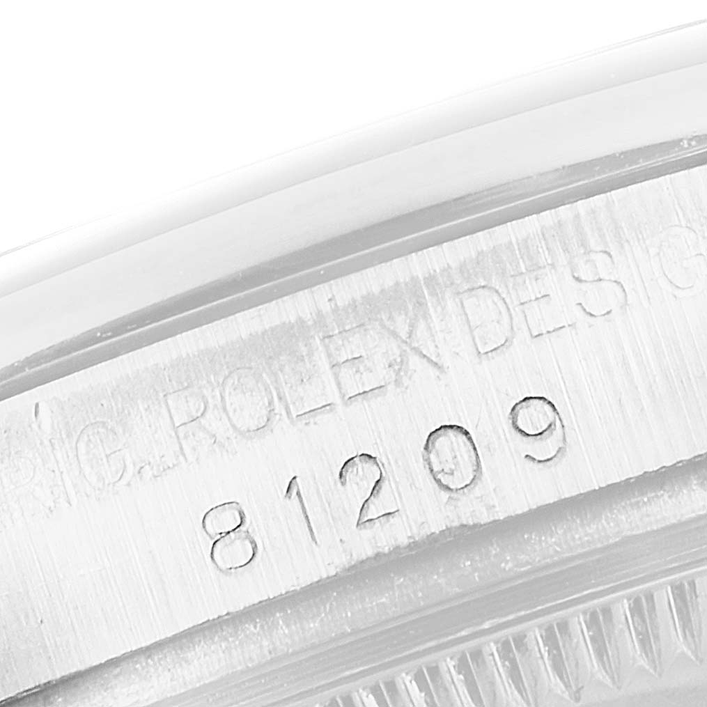 The image shows a close-up angle of the case side with engravings of the Rolex Pearlmaster 81209 Women's White Gold Mother of Pearl Dial 81209 Women's White Gold Mother of Pearl Dial model.