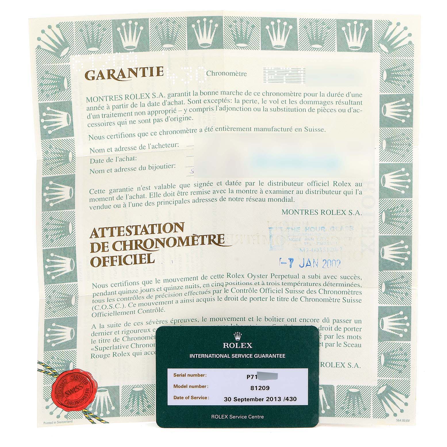 The image shows the warranty and international service guarantee card for the Rolex Pearlmaster 81209 Women's White Gold Mother of Pearl Dial 81209 Women's White Gold Mother of Pearl Dial watch from a top-down angle.