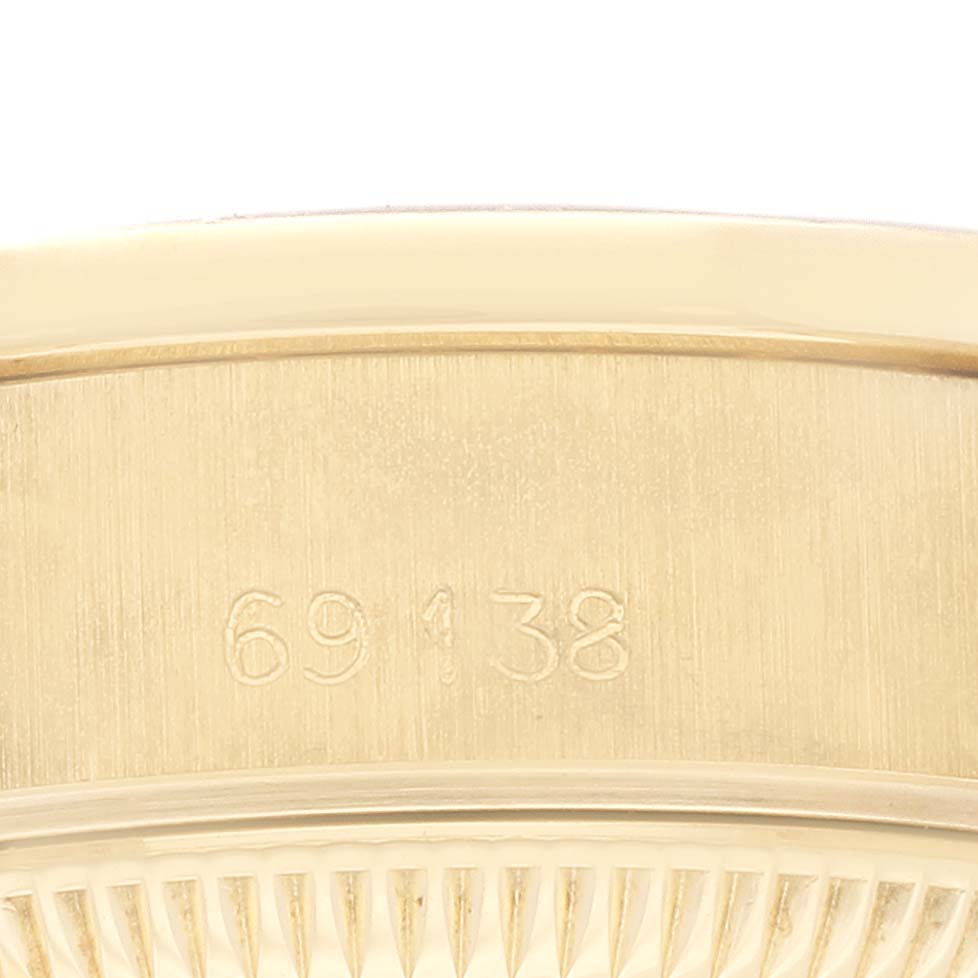 This image shows a close-up of the side case and model number engraving of a Rolex President 69138G Women
s Yellow Gold Champagne Dial 69138G Women
s Yellow Gold Champagne Dial watch.