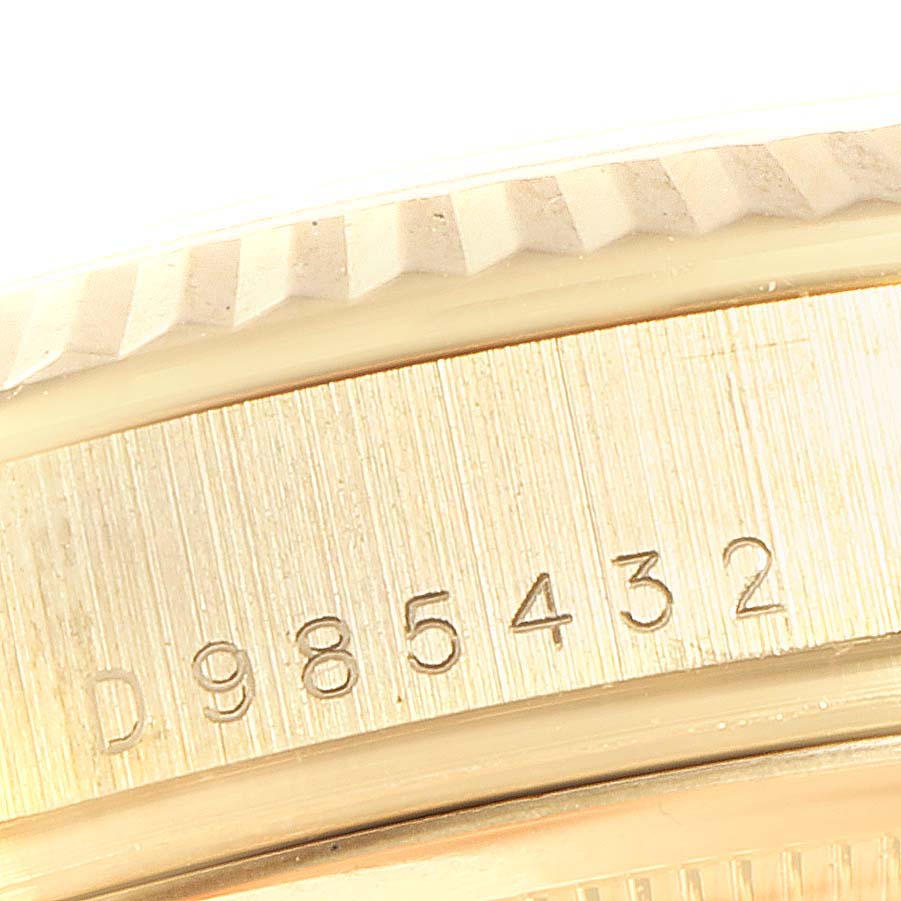 This close-up image shows the engraved serial number on the case side of a Rolex President 118238 Men
s Yellow Gold White Dial 118238 Men
s Yellow Gold White Dial model watch.