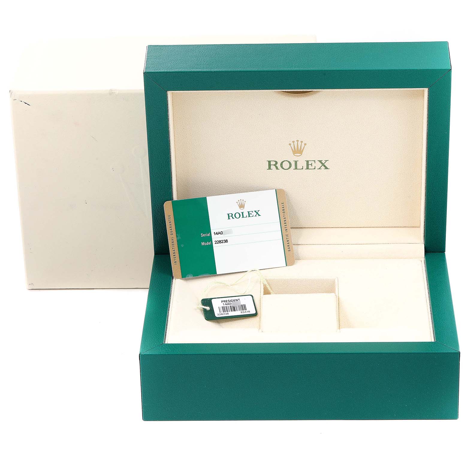 The image shows an open green and cream Rolex box for the President model, with a tag and authenticity card included.