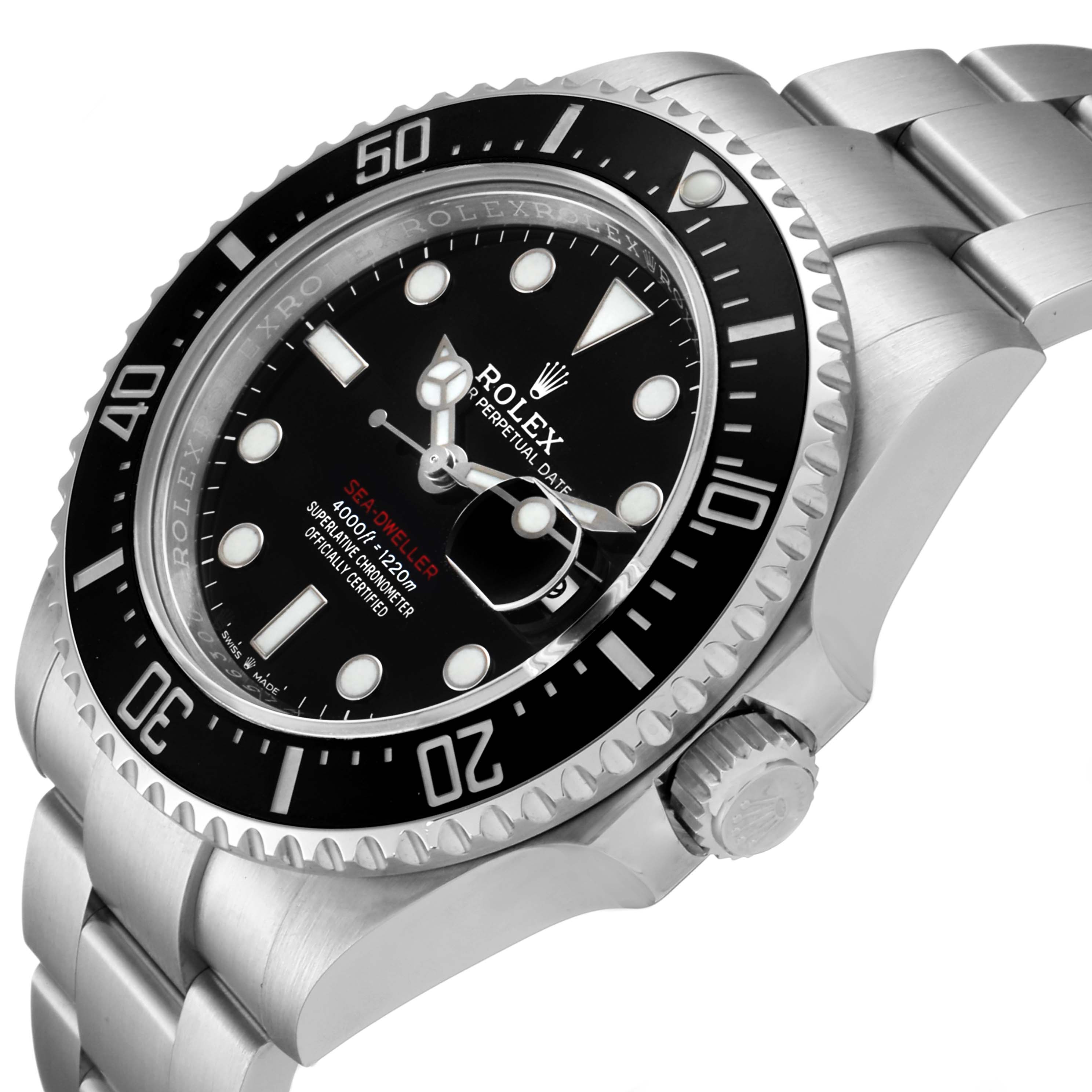 The image shows a side angle of a Rolex Sea-Dweller 126600 Men
s Stainless Steel Black Dial 126600 Men
s Stainless Steel Black Dial watch, highlighting the bezel, dial, crown, and part of the bracelet.