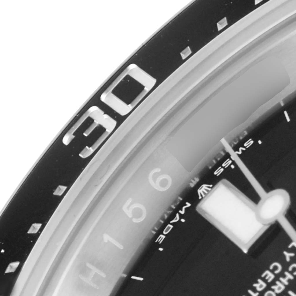 This close-up image shows the bezel, part of the dial, and the minute hand of the Rolex Sea-Dweller 126600 Men
s Stainless Steel Black Dial 126600 Men
s Stainless Steel Black Dial watch.
