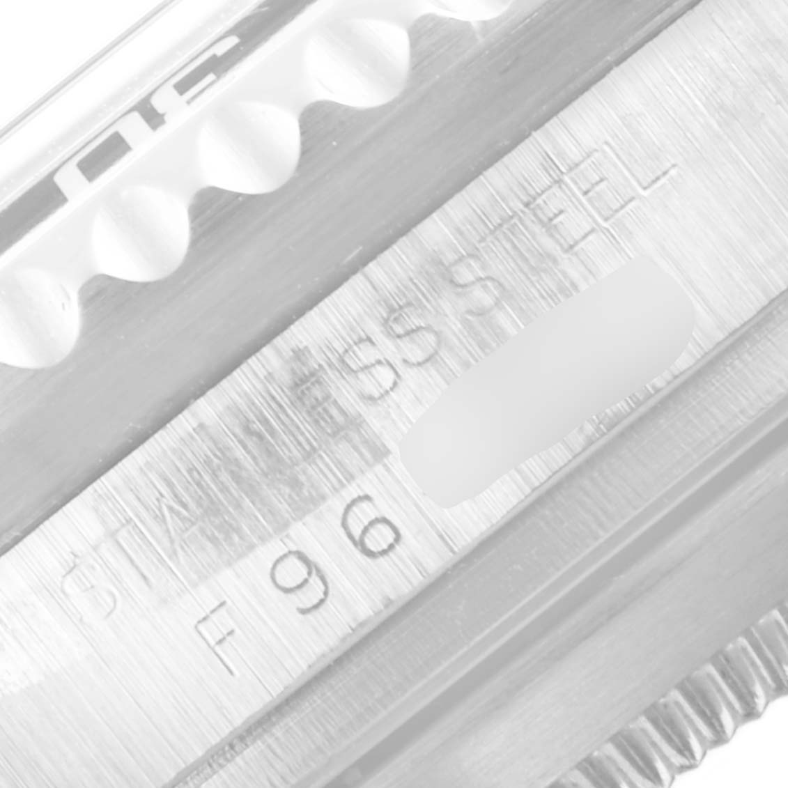 This close-up image of a Rolex Sea-Dweller 16600 Men
s Stainless Steel Black Dial 16600 Men
s Stainless Steel Black Dial watch shows the engraved stainless steel text and part of the bezel.