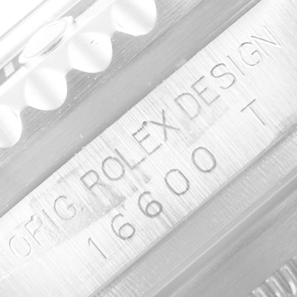 This close-up image shows the engraved case side of a Rolex Sea-Dweller 16600 Men
s Stainless Steel Black Dial 16600 Men
s Stainless Steel Black Dial, displaying the model number 16600.