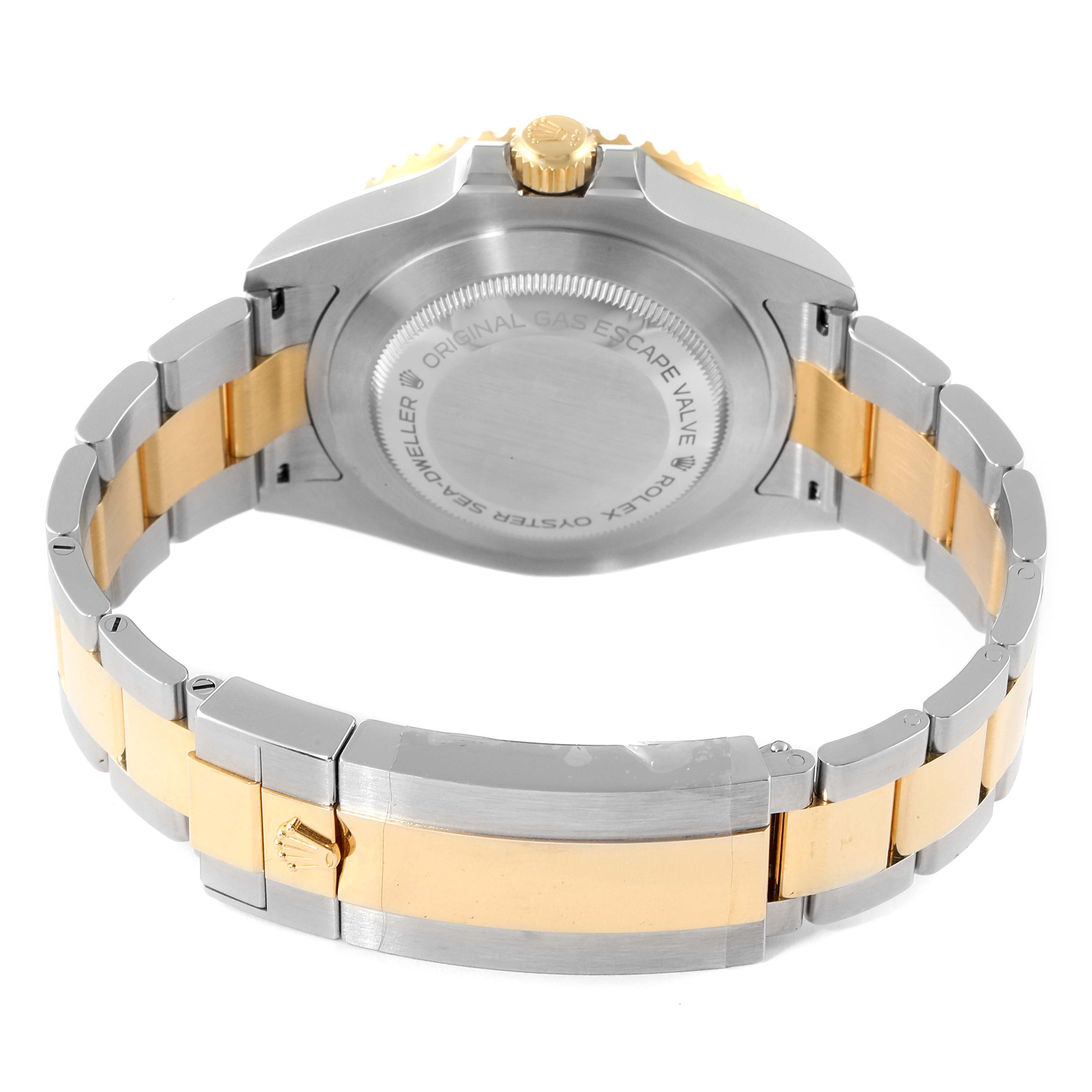 The image shows the back view of the Rolex Sea-Dweller 126603 Men's Steel and Gold (two tone) Black Dial 126603 Men's Steel and Gold (two tone) Black Dial watch, highlighting its two-tone bracelet and rear case with inscriptions.