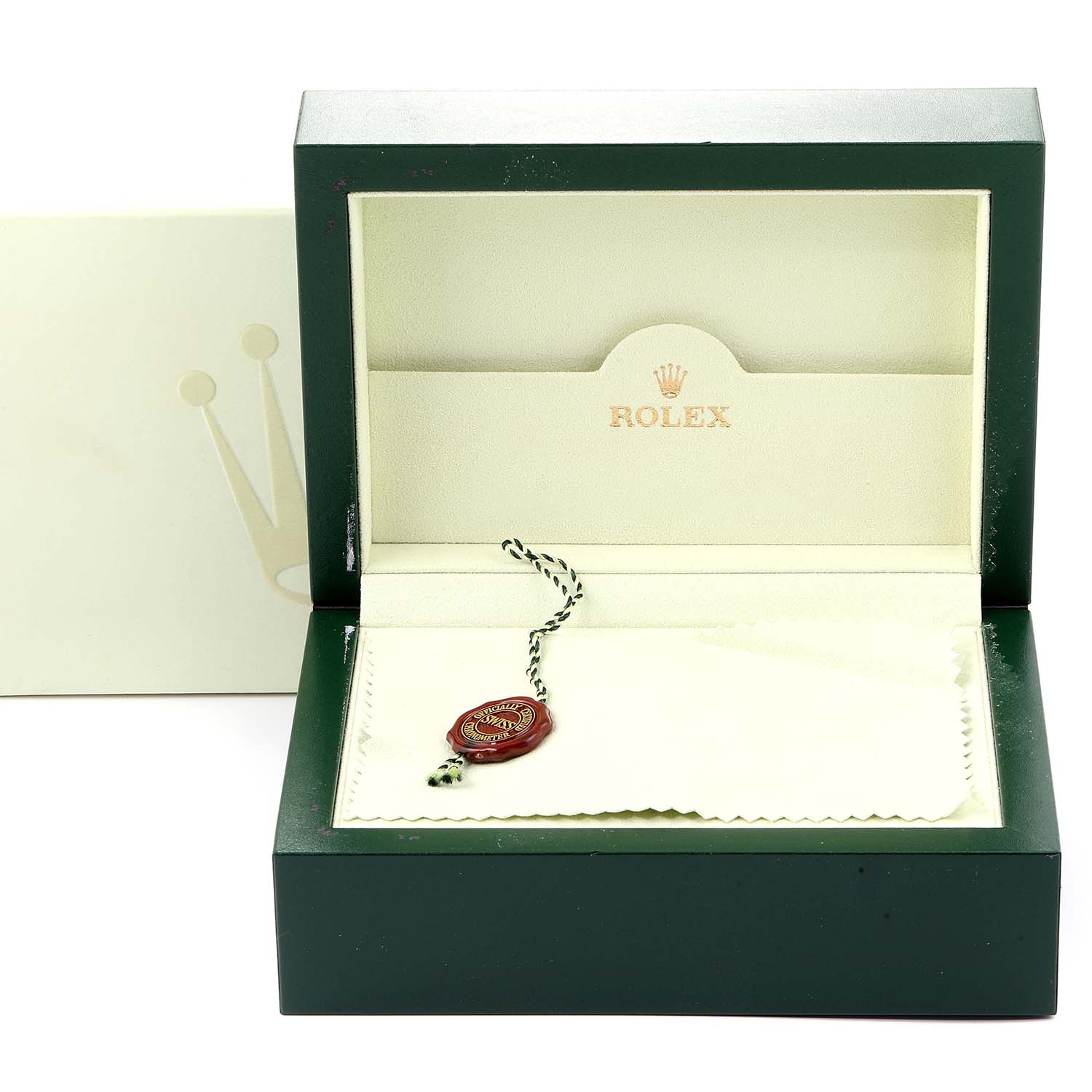 The image shows an open Rolex Submariner 16610 Men
s Stainless Steel Black Dial 16610 Men
s Stainless Steel Black Dial watch box with a tag and cleaning cloth inside.