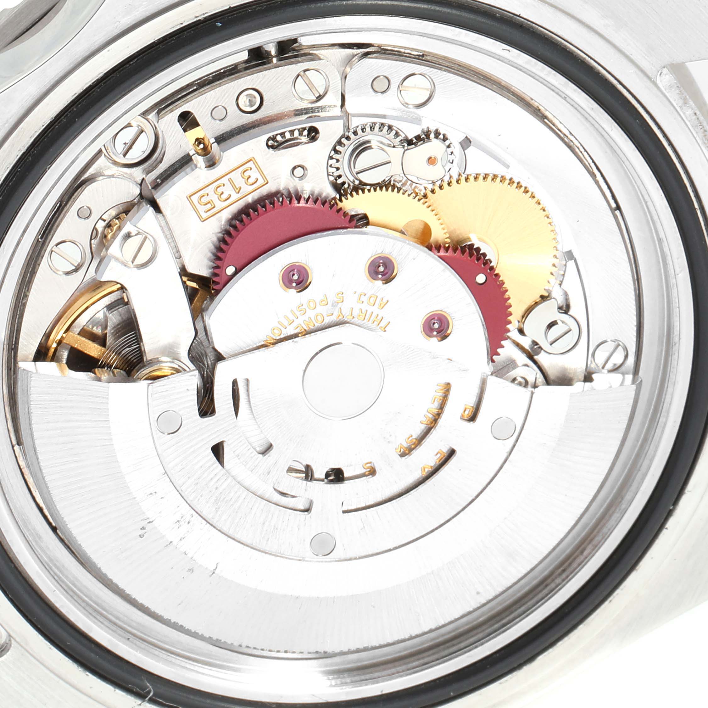 The image shows the internal mechanism of a Rolex Submariner 16610 Men
s Stainless Steel Black Dial 16610 Men
s Stainless Steel Black Dial watch viewed from the back.