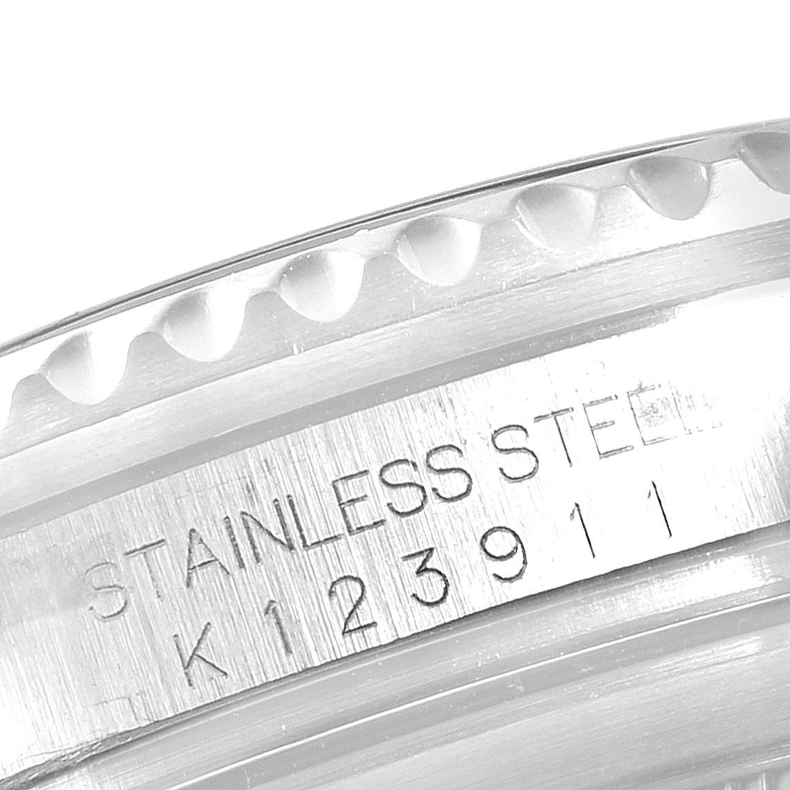 This image shows a close-up of the stainless steel casing and serial number of a Rolex Submariner 16610 Men
s Stainless Steel Black Dial 16610 Men
s Stainless Steel Black Dial model.