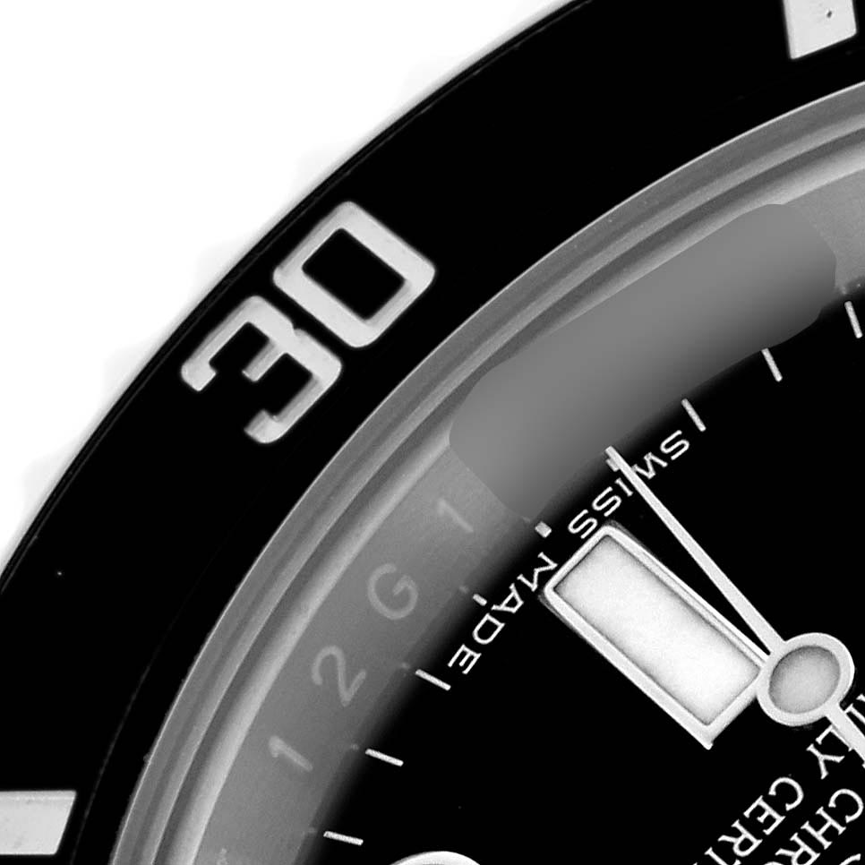 The image shows a close-up of the Rolex Submariner 116610 Men's Stainless Steel Black Dial 116610 Men's Stainless Steel Black Dial's bezel, partial dial, and hands at an angled view.