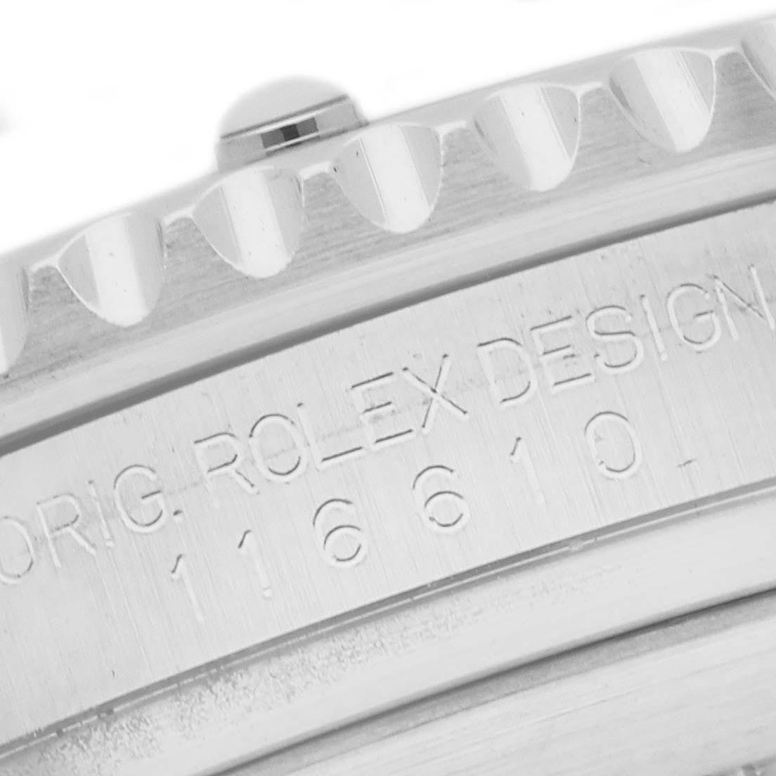 The image shows a close-up of the edge of the bezel and engraved text on a Rolex Submariner 116610 Men's Stainless Steel Black Dial 116610 Men's Stainless Steel Black Dial watch case.