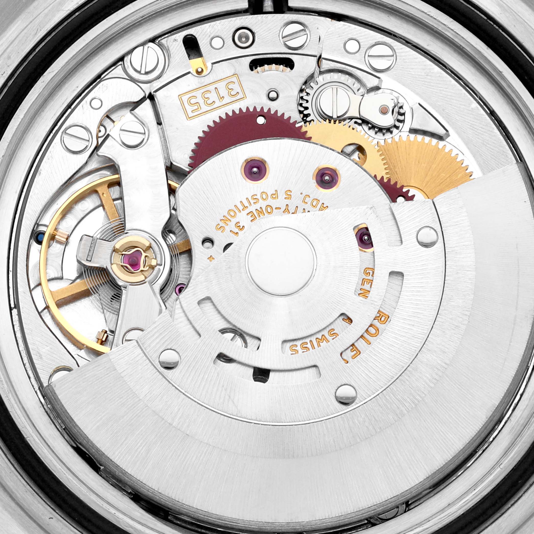 This is a close-up view of the inner movement mechanism of a Rolex Submariner 16610 Men
s Stainless Steel Black Dial 16610 Men
s Stainless Steel Black Dial watch, showing gears, rotors, and other components.