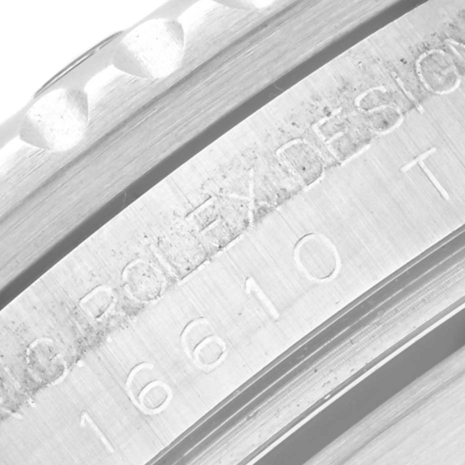 This image shows a close-up of the bezel and engraving on the caseback of a Rolex Submariner 16610 Men
s Stainless Steel Black Dial 16610 Men
s Stainless Steel Black Dial watch.