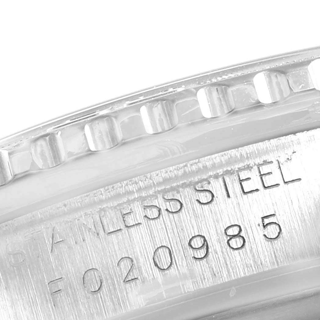 The image shows a close-up of the bezel and part of the stainless steel case with serial numbers of the Rolex Turn-o-Graph 16264 Men
s Stainless Steel Black Dial 16264 Men
s Stainless Steel Black Dial watch.