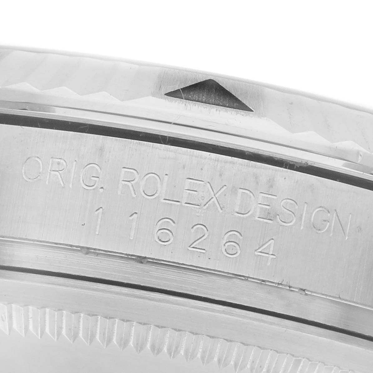 The image shows the side of a Rolex Turn-o-Graph 116264 Men's Stainless Steel Black Dial 116264 Men's Stainless Steel Black Dial watch, focusing on the engraved model number and "ORIG. ROLEX DESIGN."