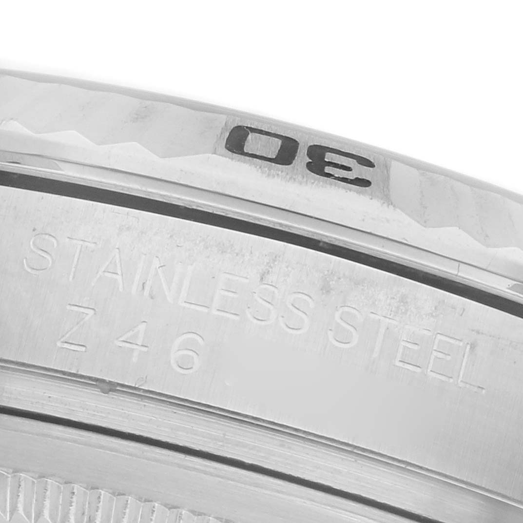 The image shows a close-up of the bezel edge and engravings on a stainless steel Rolex Turn-o-Graph 116264 Men's Stainless Steel Black Dial 116264 Men's Stainless Steel Black Dial watch.