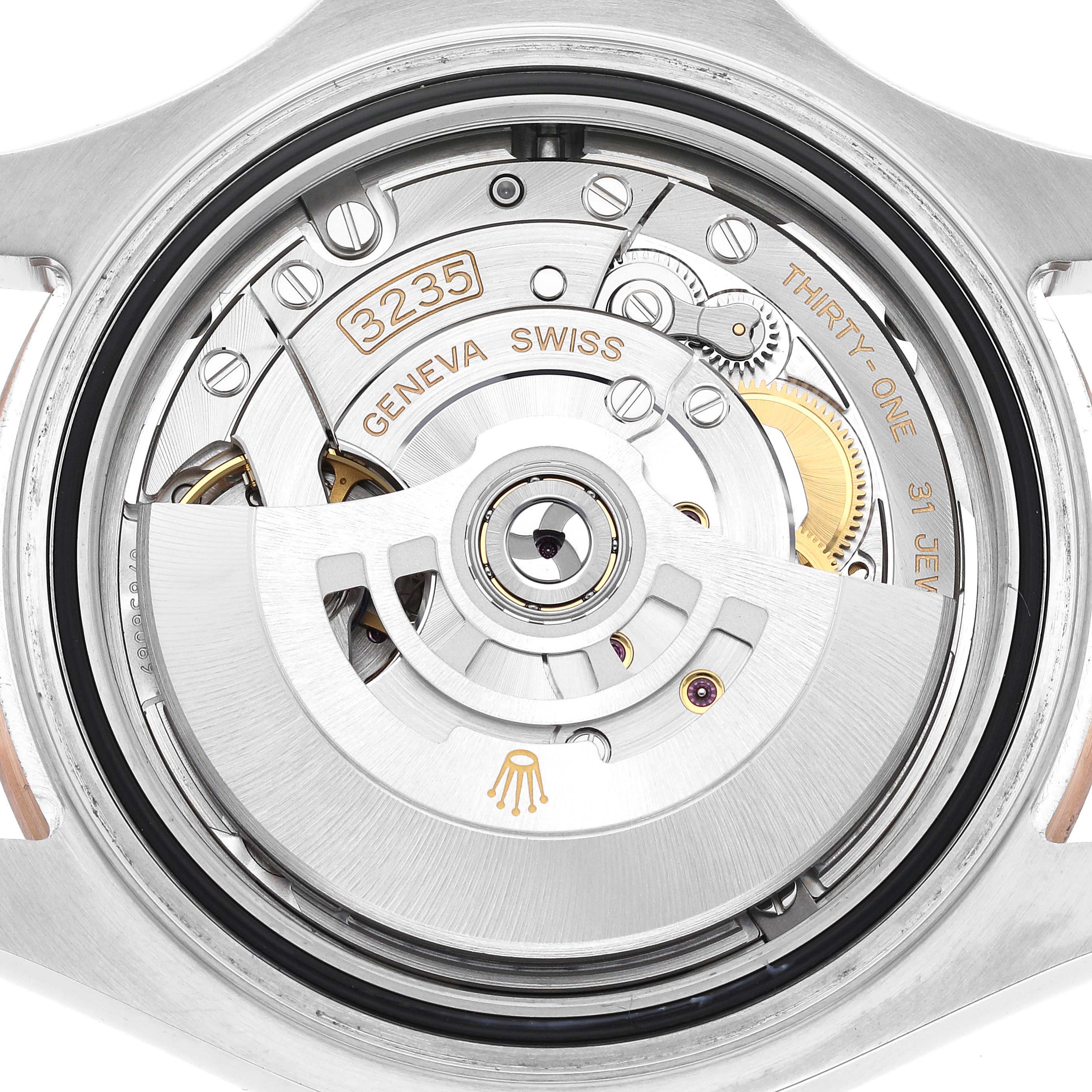 This close-up image shows the movement mechanism of the Rolex Yacht-Master 126621 Men's Steel and Gold (two tone) Black Dial 126621 Men's Steel and Gold (two tone) Black Dial watch, focusing on the 3235 caliber.