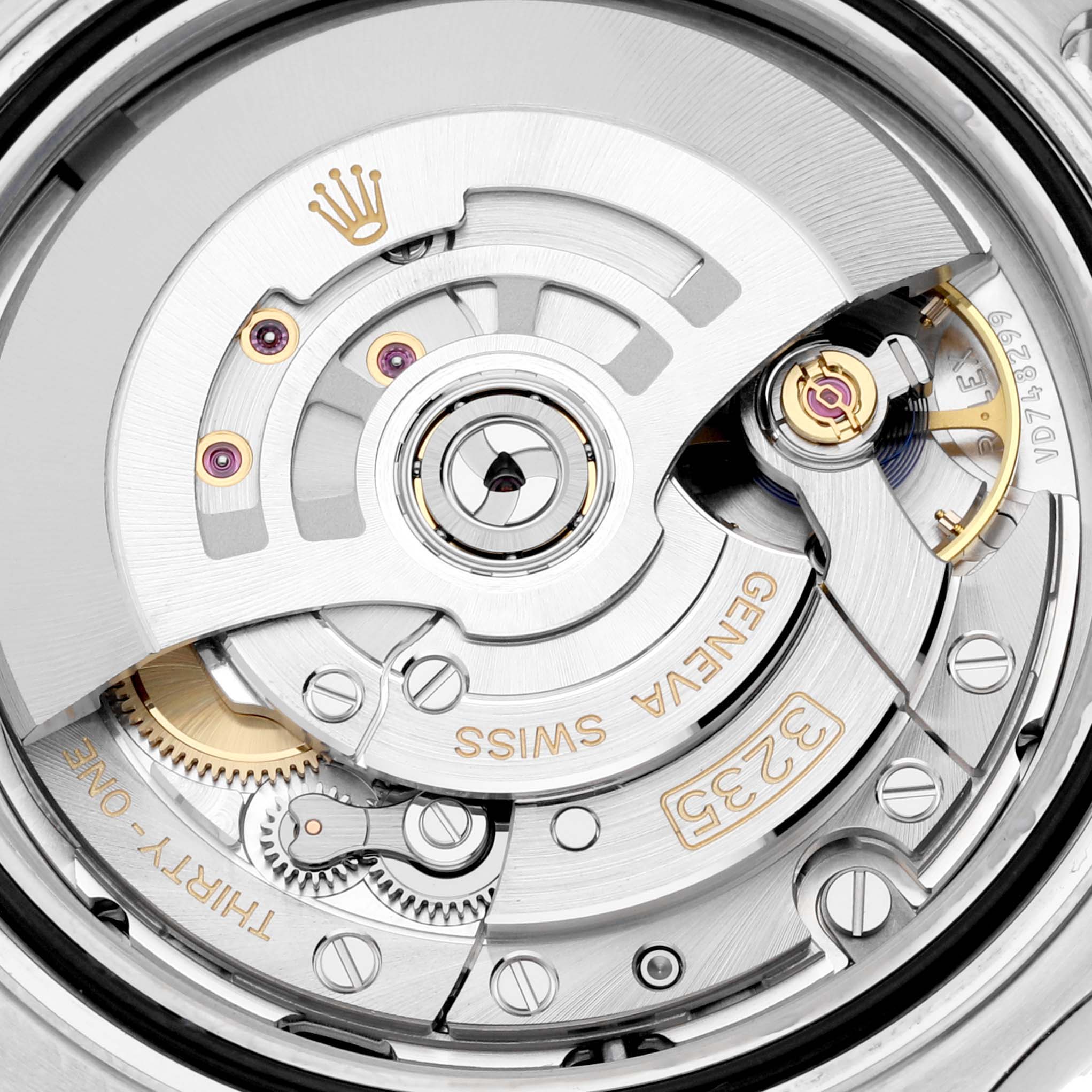 The image shows a close-up of the inner mechanics of a Rolex Yacht-Master 126621 Men's Steel and Gold (two tone) Black Dial 126621 Men's Steel and Gold (two tone) Black Dial watch, highlighting gears and the rotor.
