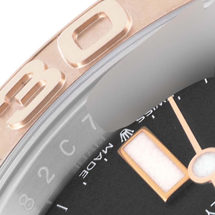 This close-up of the Rolex Yacht-Master 126621 Men's Steel and Gold (two tone) Black Dial 126621 Men's Steel and Gold (two tone) Black Dial model showcases part of the bezel and the edge of the dial.