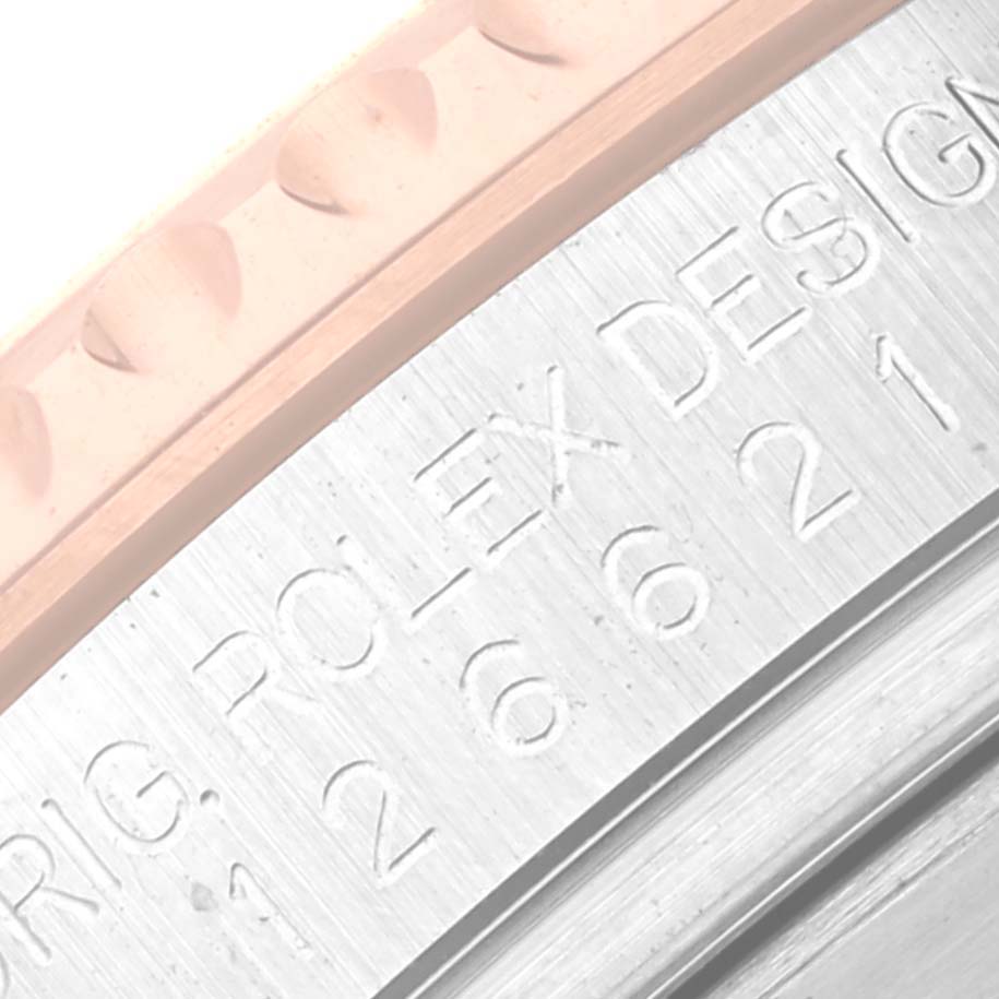 This image shows a close-up of the bezel and case back inscription of a Rolex Yacht-Master 126621 Men's Steel and Gold (two tone) Black Dial 126621 Men's Steel and Gold (two tone) Black Dial watch.