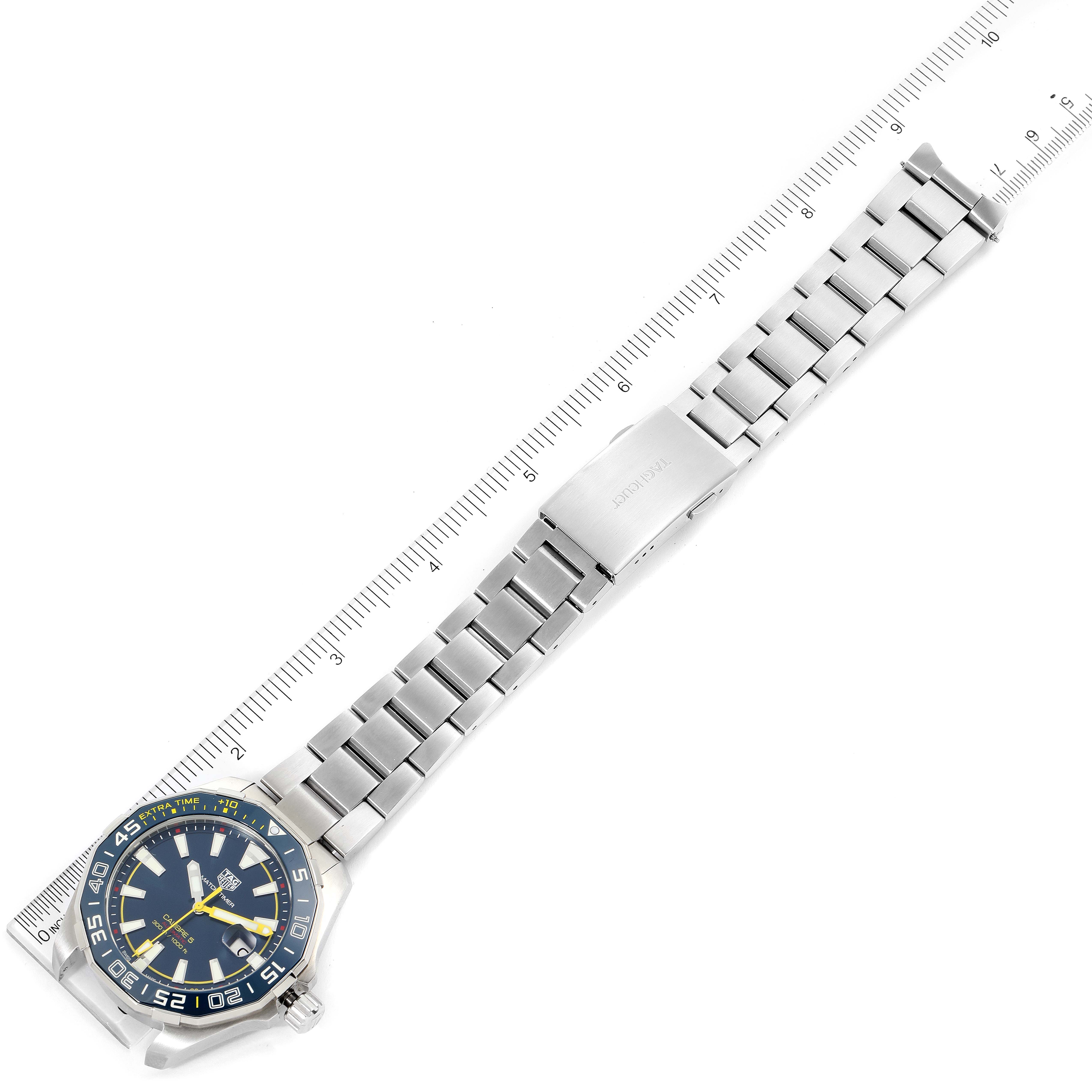 The image shows a Tag Heuer Limited Edition WAY201H.BA0927 Men's Stainless Steel Blue Dial WAY201H.BA0927 Men's Stainless Steel Blue Dial watch laid flat, displaying its face, stainless steel bracelet, and clasp alongside a measuring ruler.