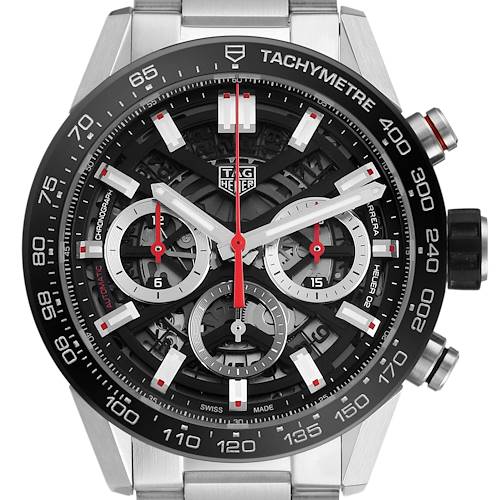 The image shows a front view of a Tag Heuer Carrera CBG2010 Men's Stainless Steel Black Dial watch, highlighting its tachymetre, chronograph dials, and skeleton dial design.