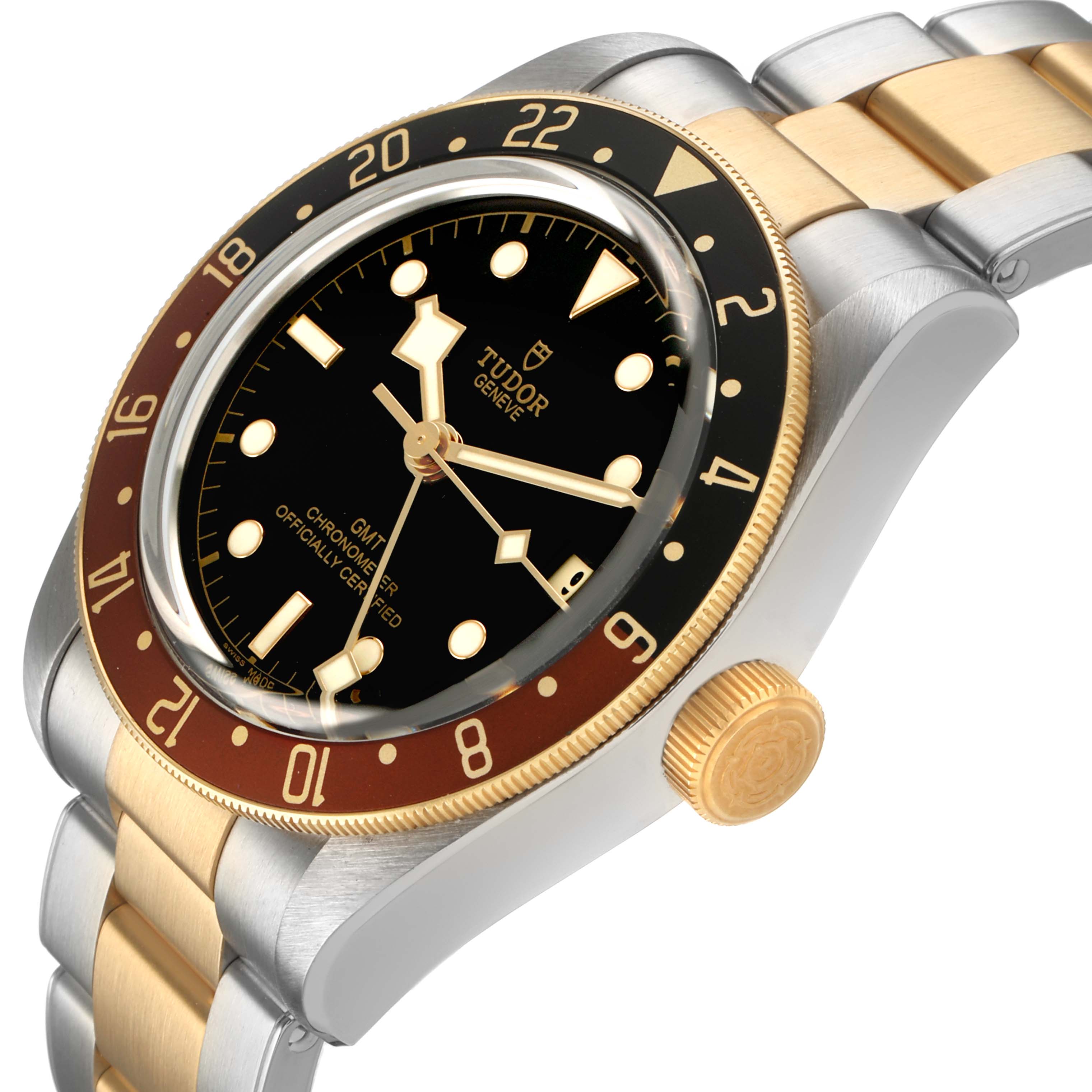 The Tudor Heritage Black Bay 79833MN Men's Steel and Gold (two tone) Black Dial watch is shown at a three-quarter angle, highlighting the bezel, dial, case, crown, and two-tone bracelet.