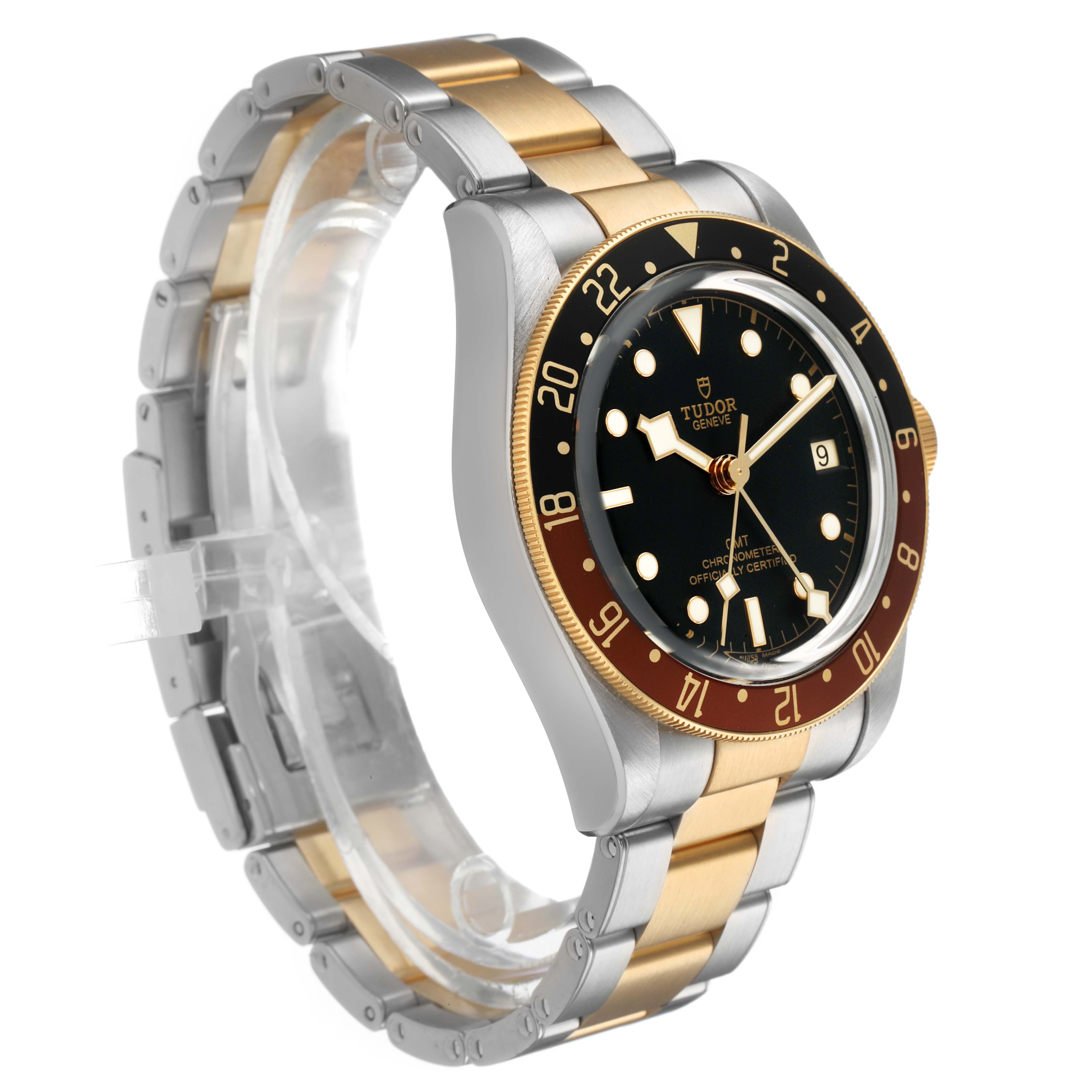 The Tudor Heritage Black Bay 79833MN Men's Steel and Gold (two tone) Black Dial watch is shown from a front-right angle, highlighting its bezel, dial, and metal bracelet.