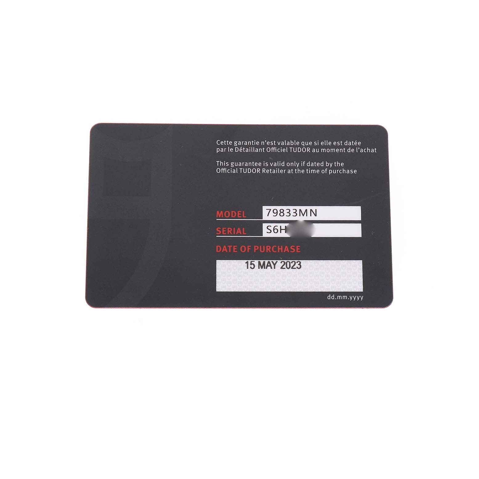 The image shows a Tudor Heritage Black Bay 79833MN Men's Steel and Gold (two tone) Black Dial warranty card, displaying the model number and purchase date.