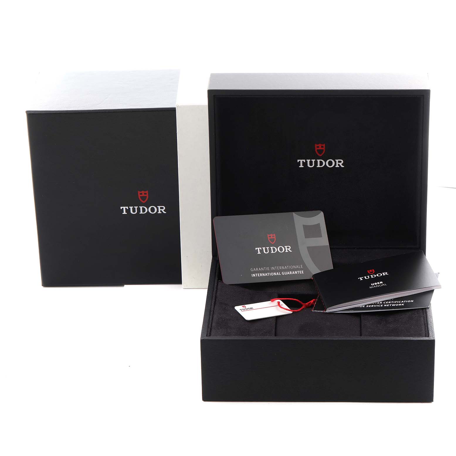 The image shows the Tudor Pelagos 25407 Men's Titanium Black Dial 25407 Men's Titanium Black Dial packaging, including an open box, warranty card, and booklet.