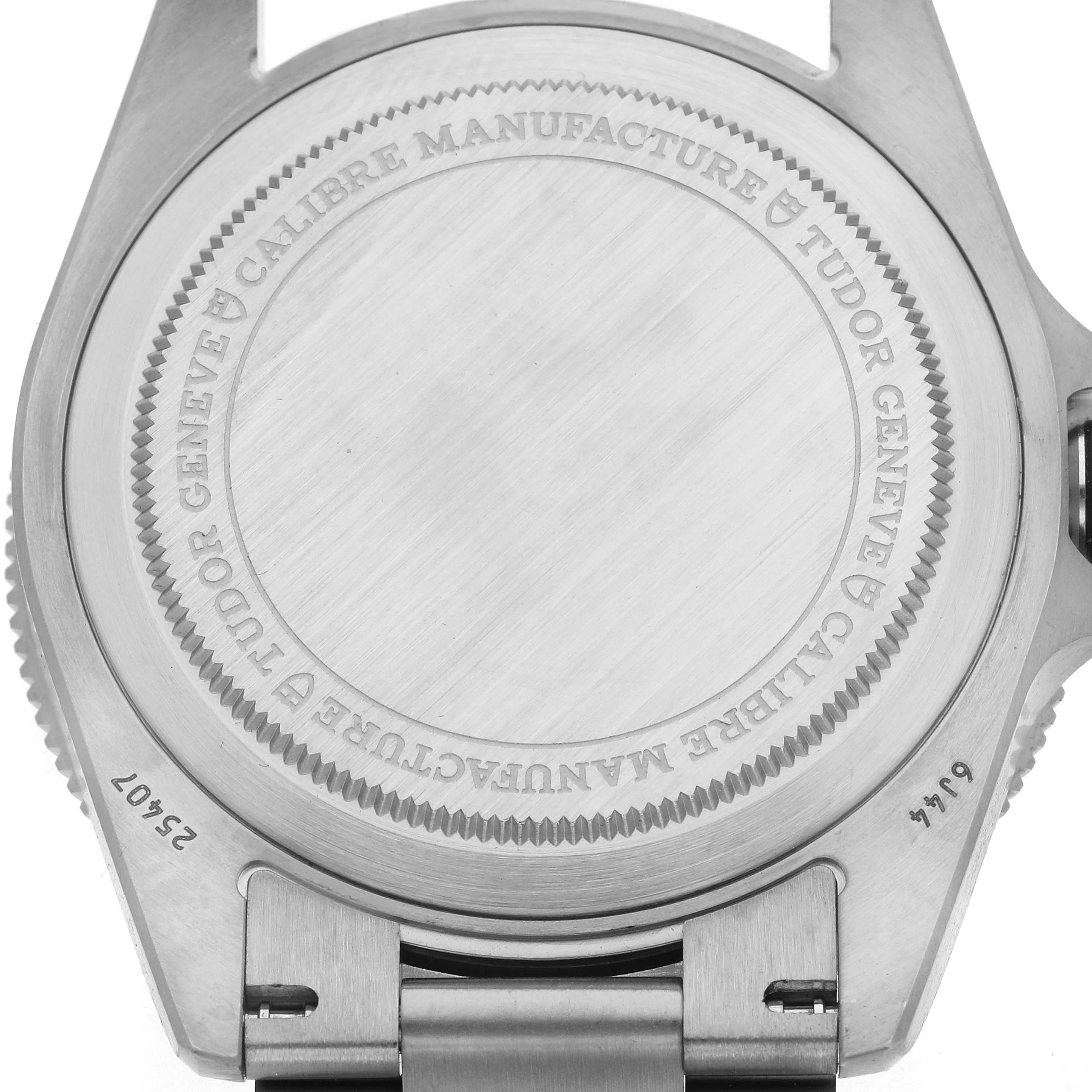 The image shows the back case of the Tudor Pelagos 25407 Men's Titanium Black Dial 25407 Men's Titanium Black Dial watch with engraved details.