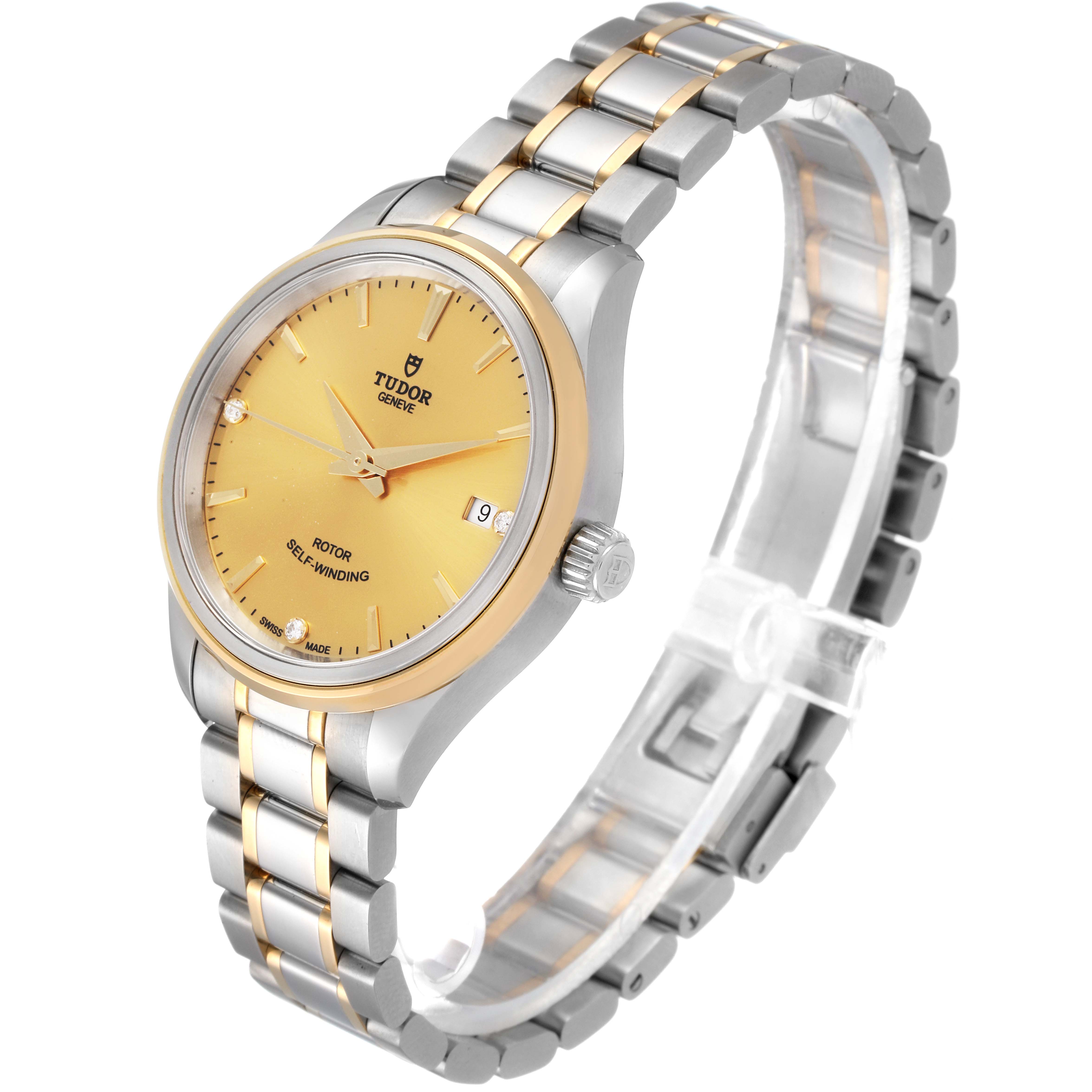 This Tudor Style M12303 Women's Steel and Gold (two tone) Champagne Dial M12303 Women's Steel and Gold (two tone) Champagne Dial watch is shown at an angle, displaying its face, crown, two-tone bracelet, and date window.