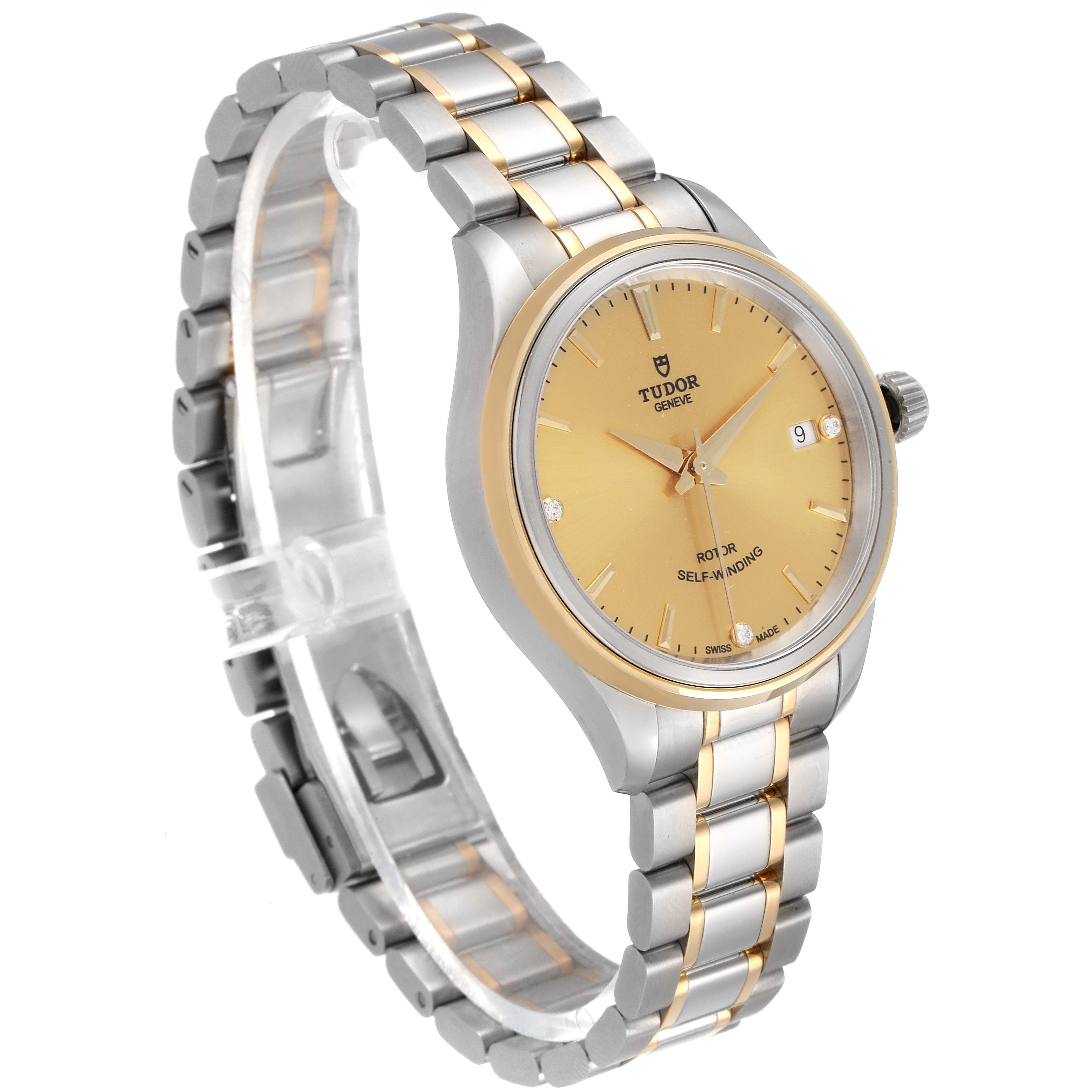 The Tudor Style M12303 Women's Steel and Gold (two tone) Champagne Dial M12303 Women's Steel and Gold (two tone) Champagne Dial model watch is shown from an angle highlighting the face, crown, bracelet, and clasp.