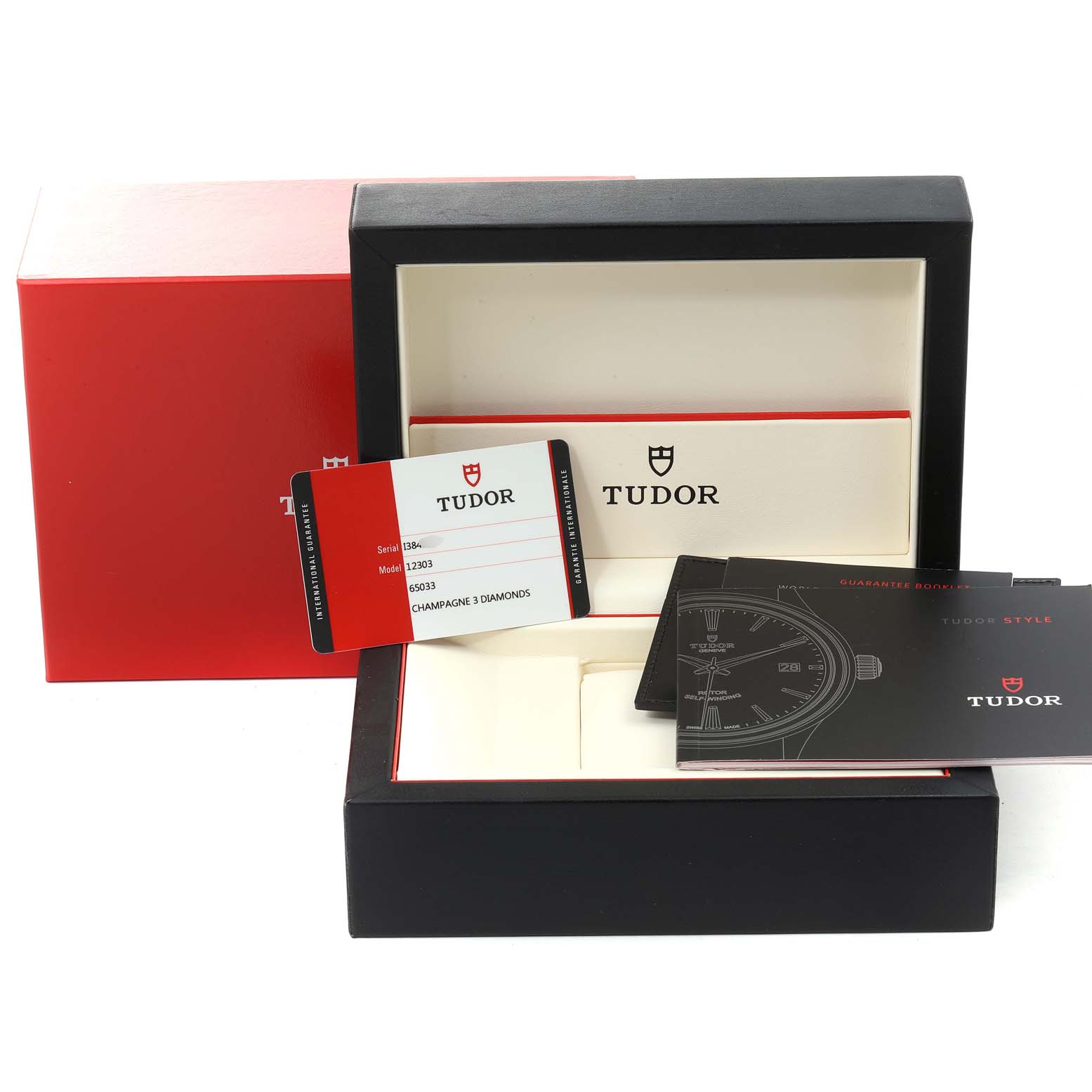This image shows the box, guarantee card, and manuals for the Tudor Style M12303 Women's Steel and Gold (two tone) Champagne Dial M12303 Women's Steel and Gold (two tone) Champagne Dial watch.