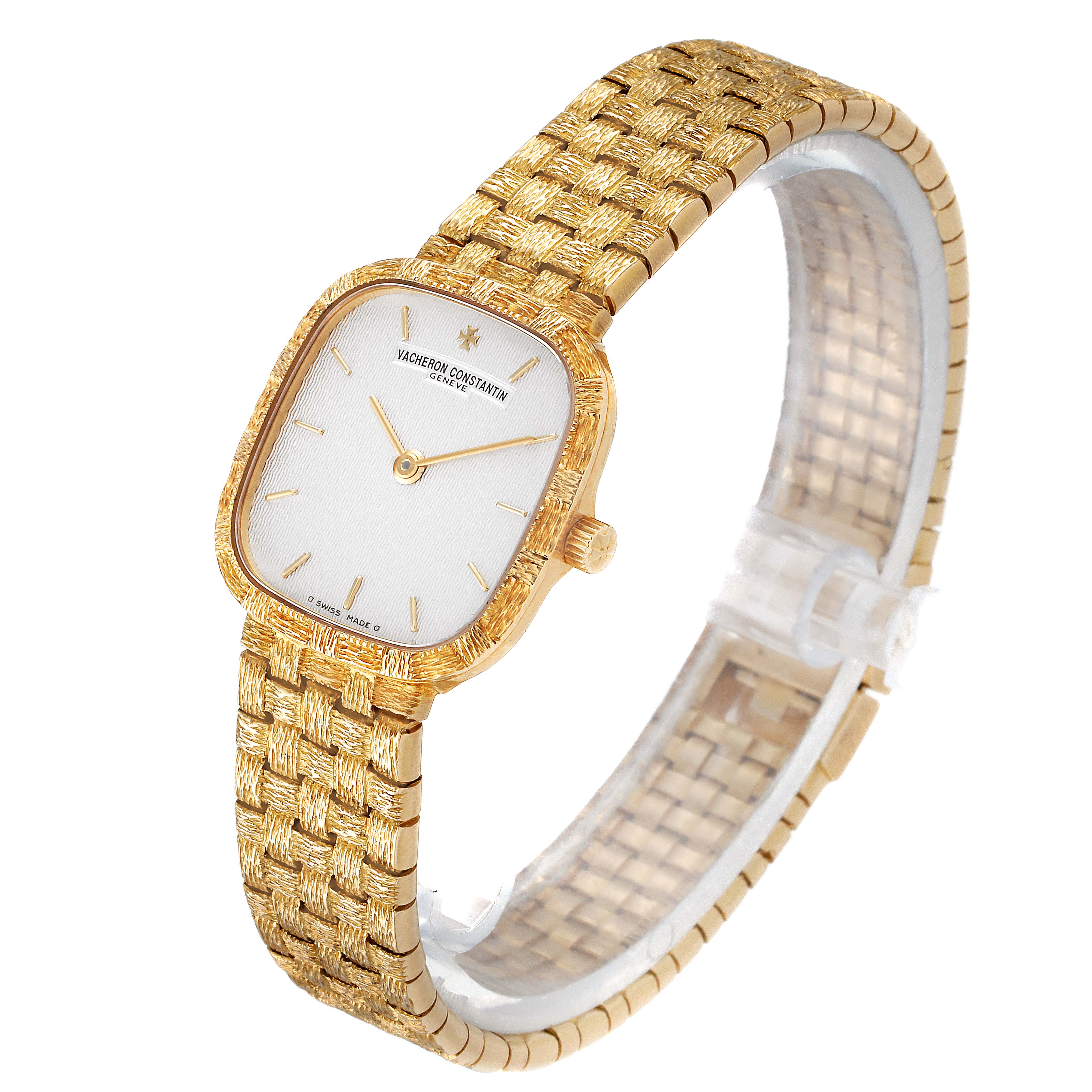 This Vacheron Constantin Vintage Women's Yellow Gold Silver Dial Women's Yellow Gold Silver Dial watch is shown from an angled view, displaying the dial, gold bezel, and woven bracelet.