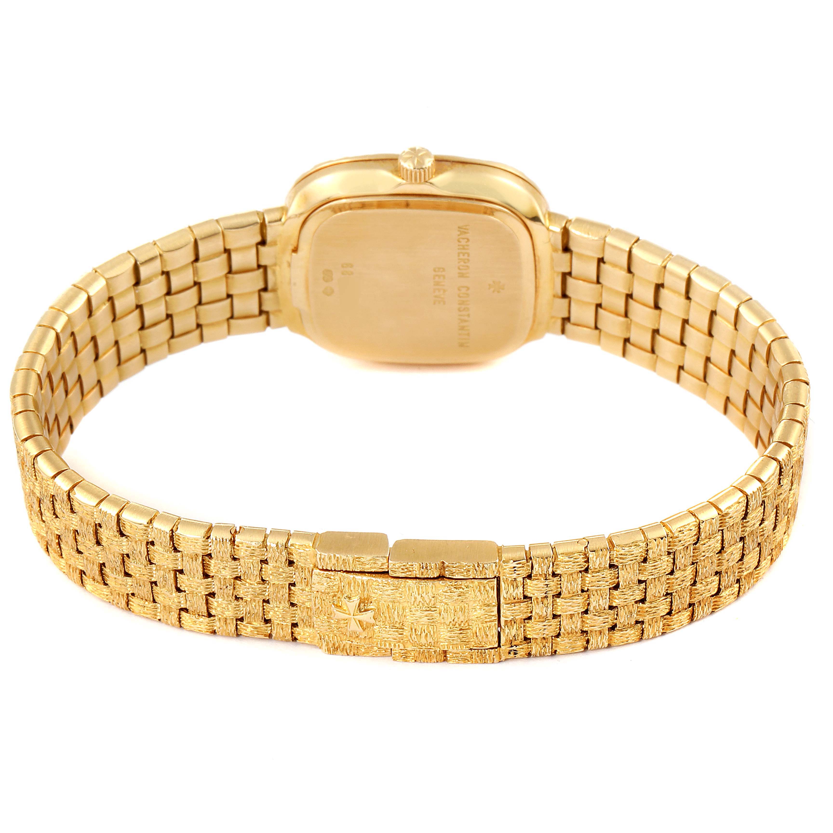 The image shows the back of the Vintage Vacheron Constantin watch, highlighting its gold case and detailed bracelet clasp.