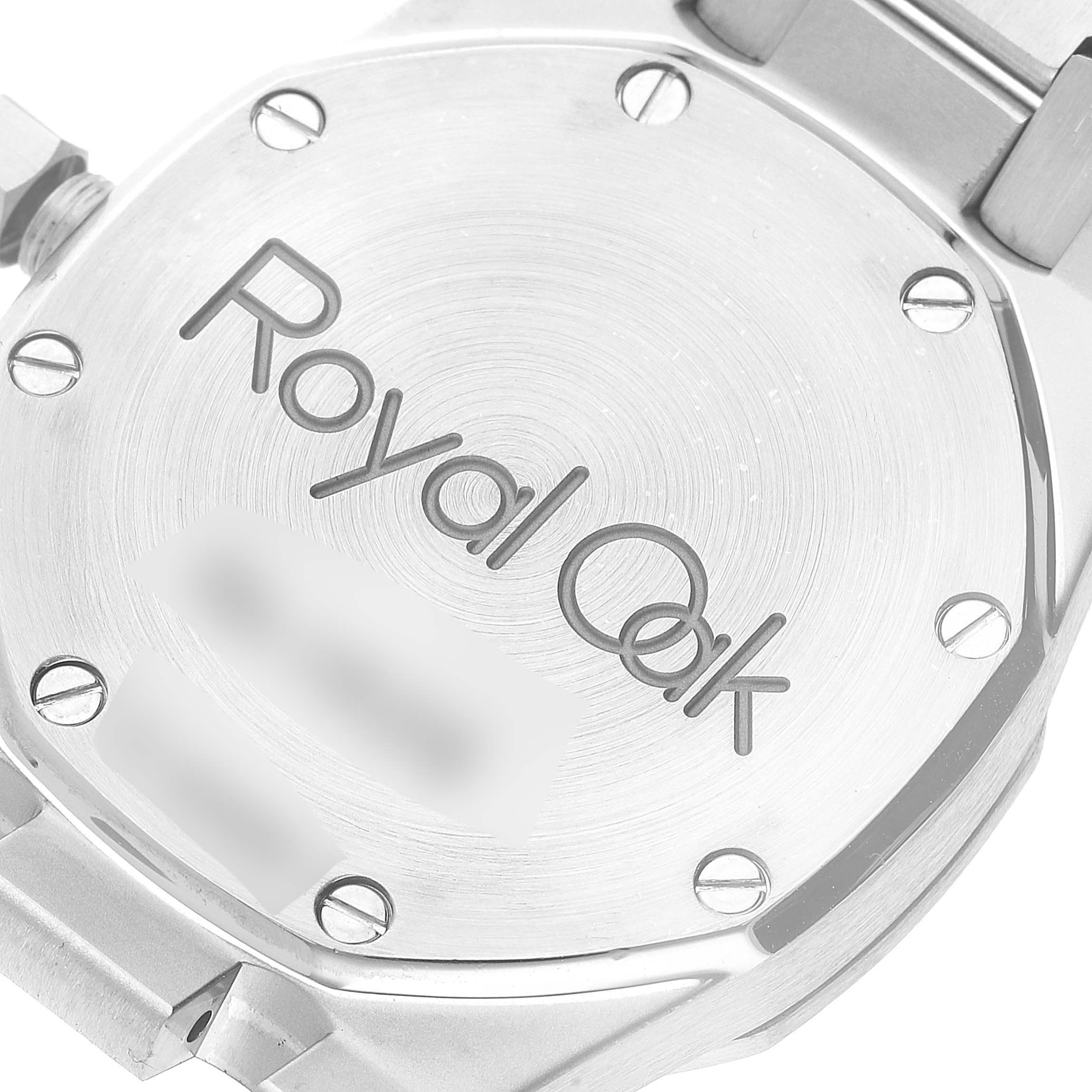 The image shows the back case of a Royal Oak watch by Audemars Piguet, highlighting its screws and engravings.