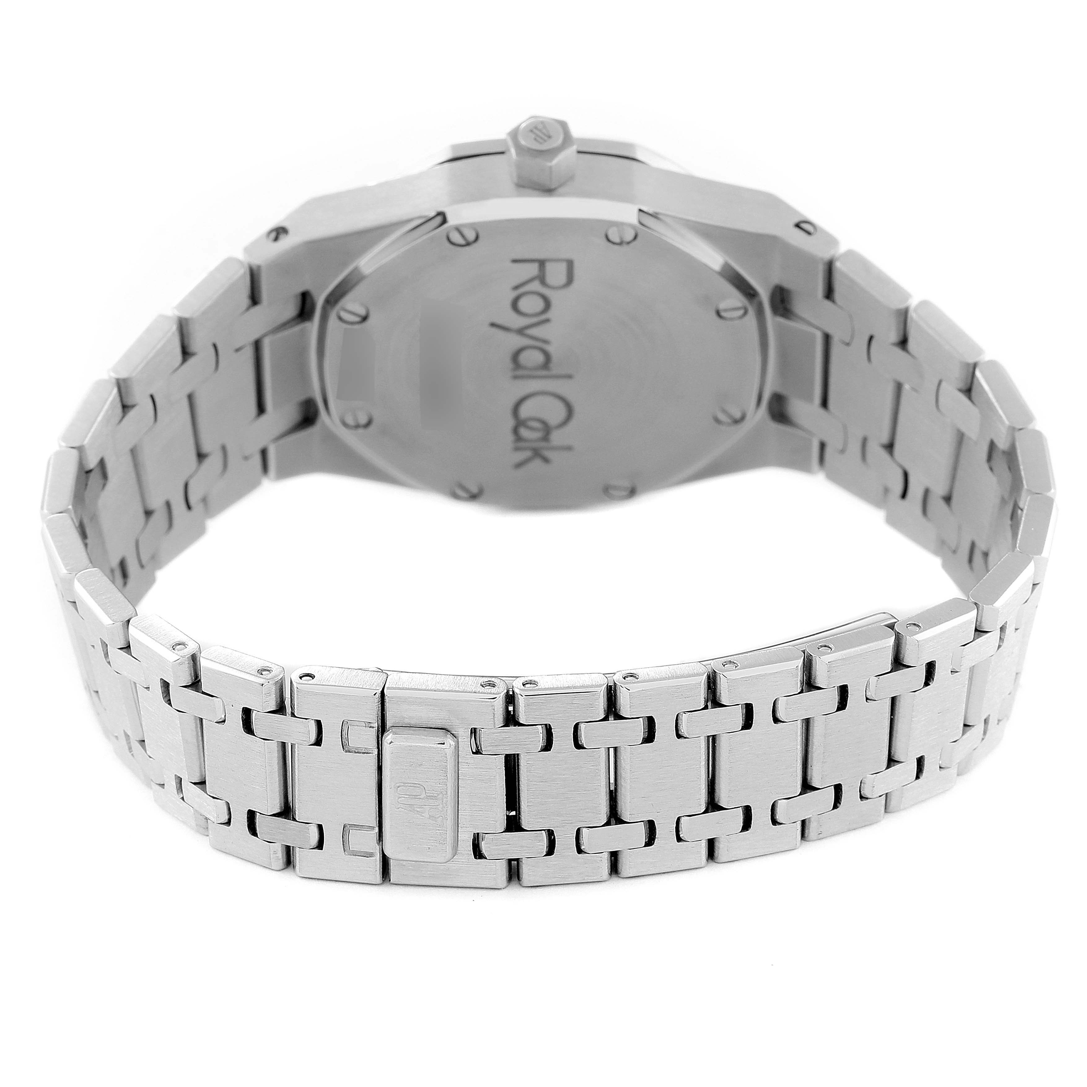 The image shows the back and bracelet of a Royal Oak watch by Audemars Piguet, highlighting the engraved case back and clasp.