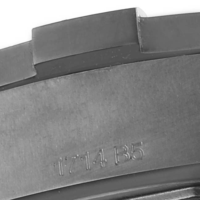 This image shows a close-up of the bezel and part of the case back of the Breitling Avenger V17310 Men's Titanium Black Dial V17310 Men's Titanium Black Dial watch.