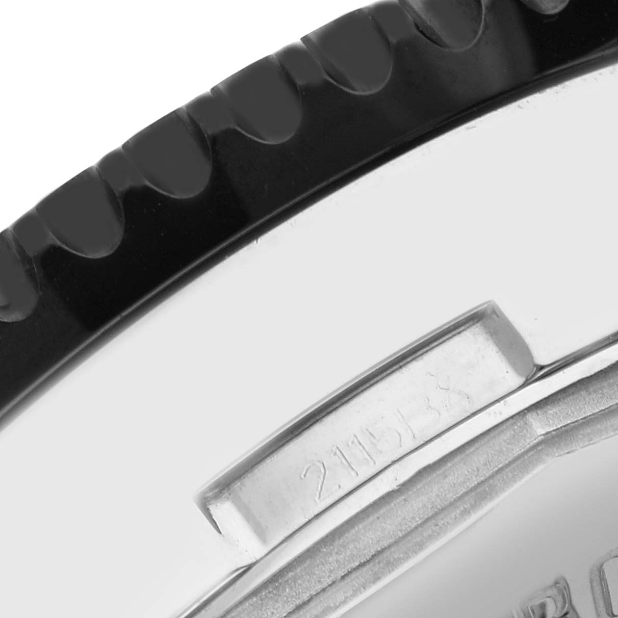 The image shows a close-up of the bezel and part of the case side of the Breitling Chronoliner Y2431012/BE10 Men's Stainless Steel Black Dial Y2431012/BE10 Men's Stainless Steel Black Dial watch model.