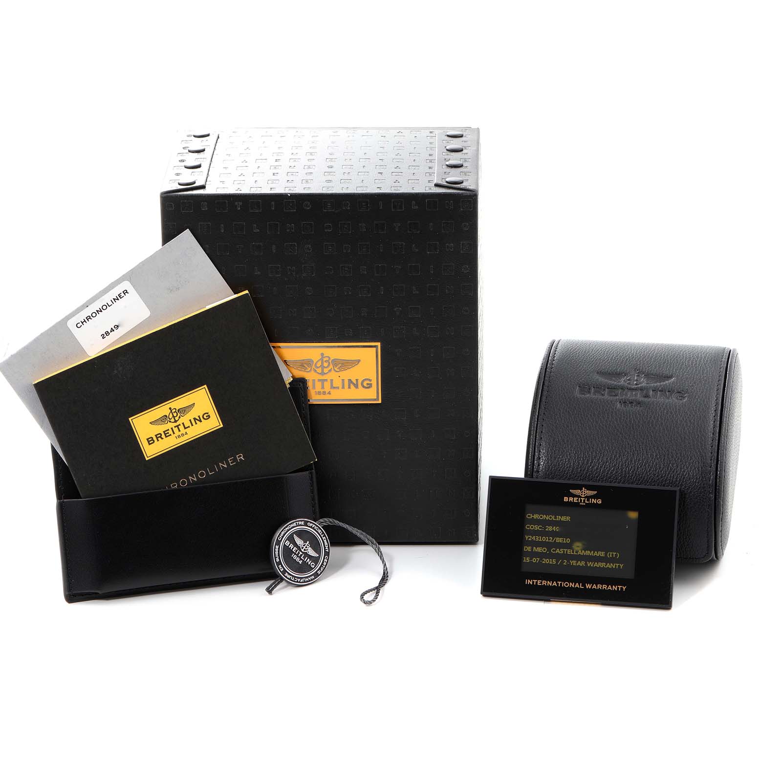 This image shows the packaging, warranty card, carrying case, and tags of the Breitling Chronoliner Y2431012/BE10 Men's Stainless Steel Black Dial Y2431012/BE10 Men's Stainless Steel Black Dial watch.
