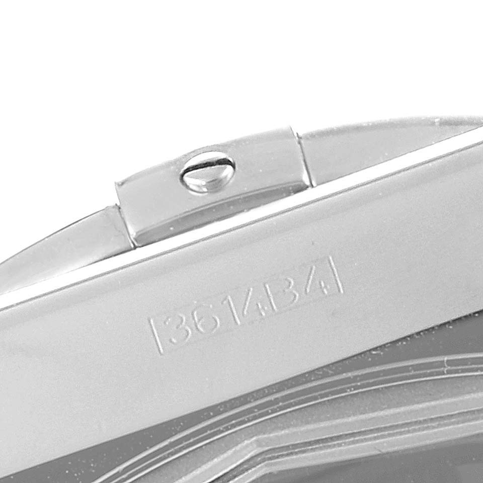 This image shows a close-up of a segment of the bracelet and clasp with engraving on a Breitling Chronomat AB0115 Men
s Stainless Steel Black Dial AB0115 Men
s Stainless Steel Black Dial watch.