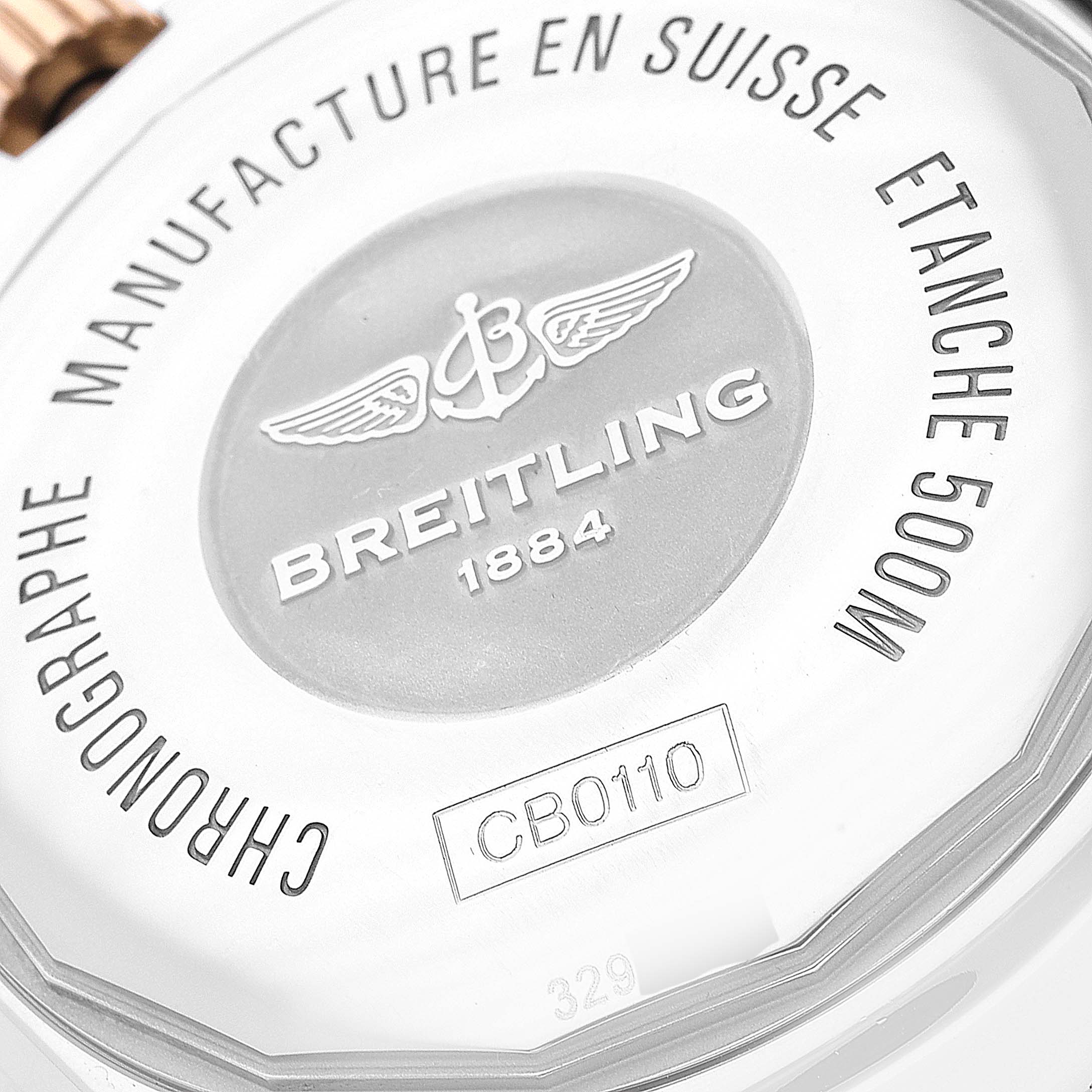 The image shows the back case of the Breitling Chronomat CB0110121B1C1 Men's Steel and Gold (two tone) Black Dial CB0110121B1C1 Men's Steel and Gold (two tone) Black Dial watch, highlighting the branding and model details.