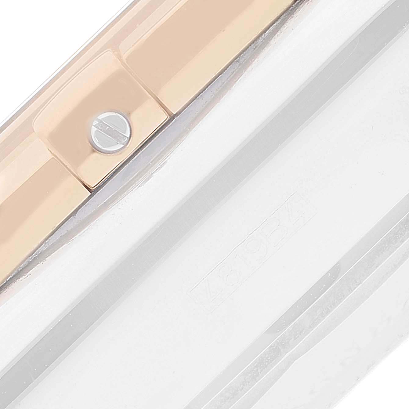 The image shows a close-up side view of the case edge and a part of the bezel of the Breitling Chronomat CB0110121B1C1 Men's Steel and Gold (two tone) Black Dial CB0110121B1C1 Men's Steel and Gold (two tone) Black Dial watch.