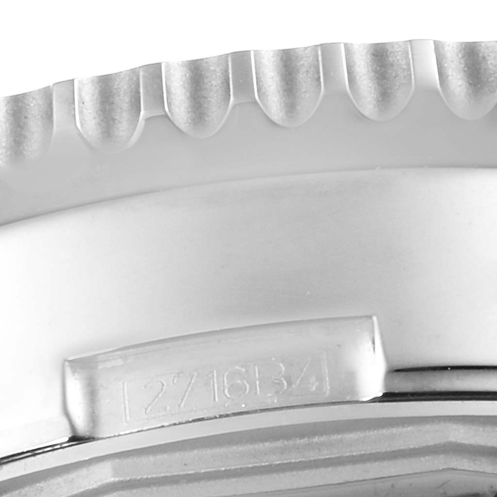 This image shows a close-up view of the side bezel and a section of the case of the Breitling Navitimer A21350 Men's Stainless Steel Black Dial A21350 Men's Stainless Steel Black Dial watch.