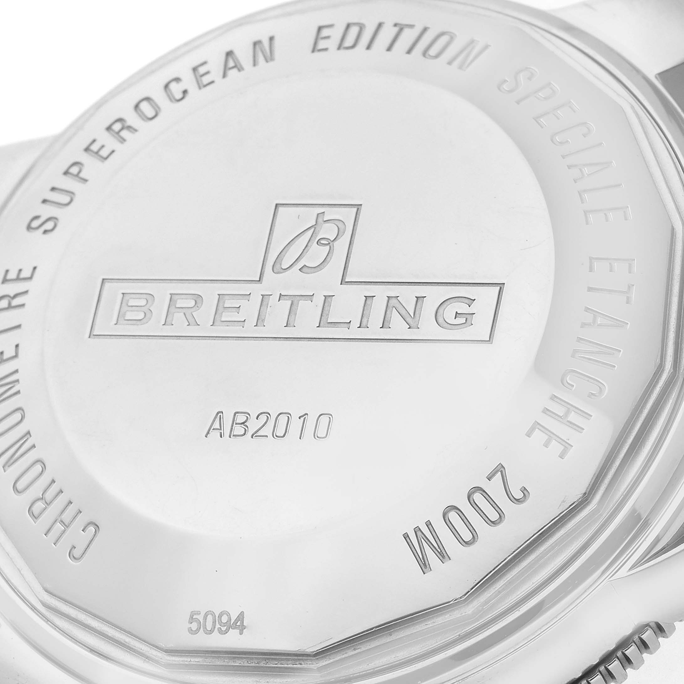 The image shows the back view of a Breitling Superocean AB2010 Men's Stainless Steel Black Dial AB2010 Men's Stainless Steel Black Dial watch, highlighting the engravings and model number.