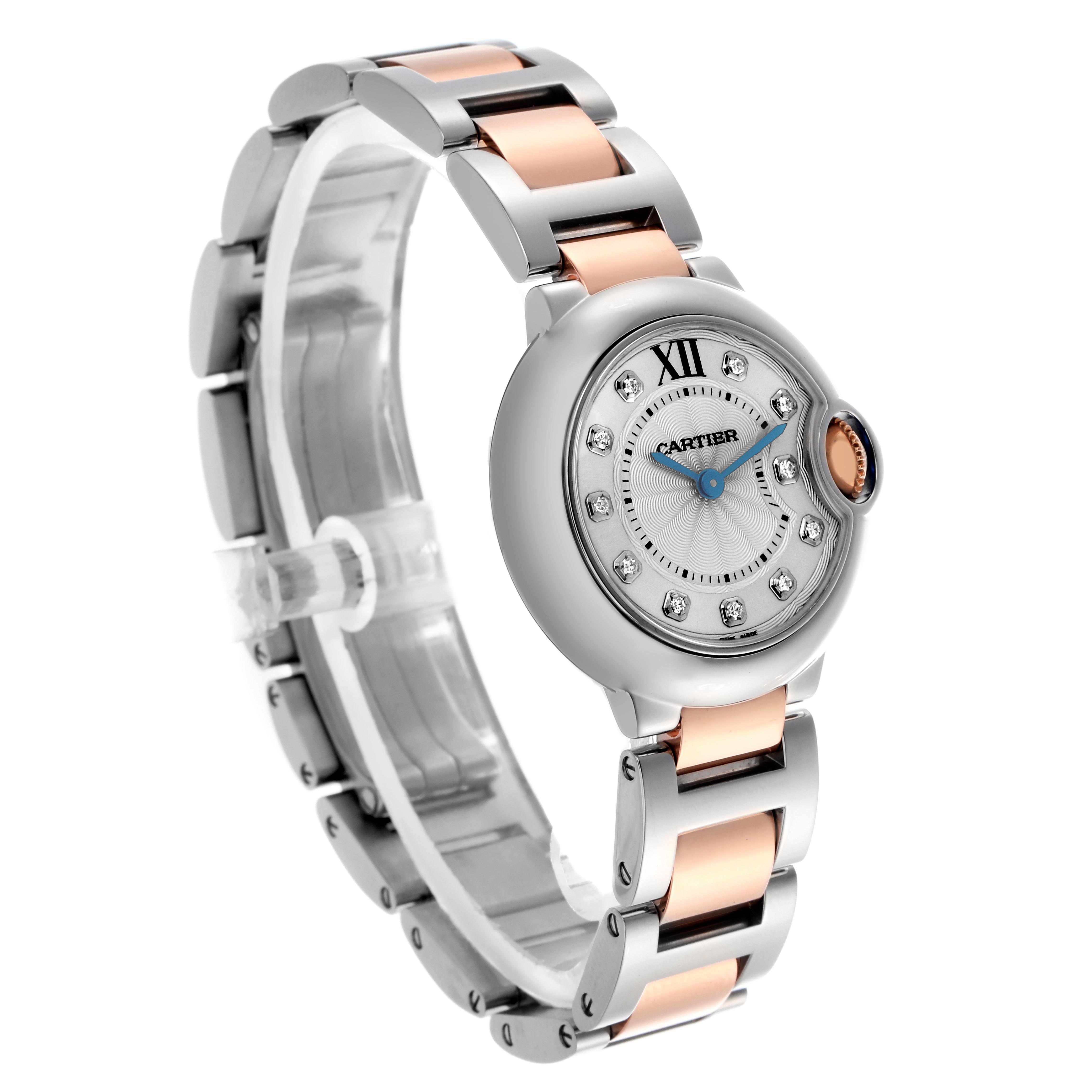 The Cartier Ballon Bleu WE902030 Women
s Steel and Gold (two tone) Silver Dial WE902030 Women
s Steel and Gold (two tone) Silver Dial watch is shown at a three-quarter angle, highlighting its round face, crown, and two-tone bracelet.