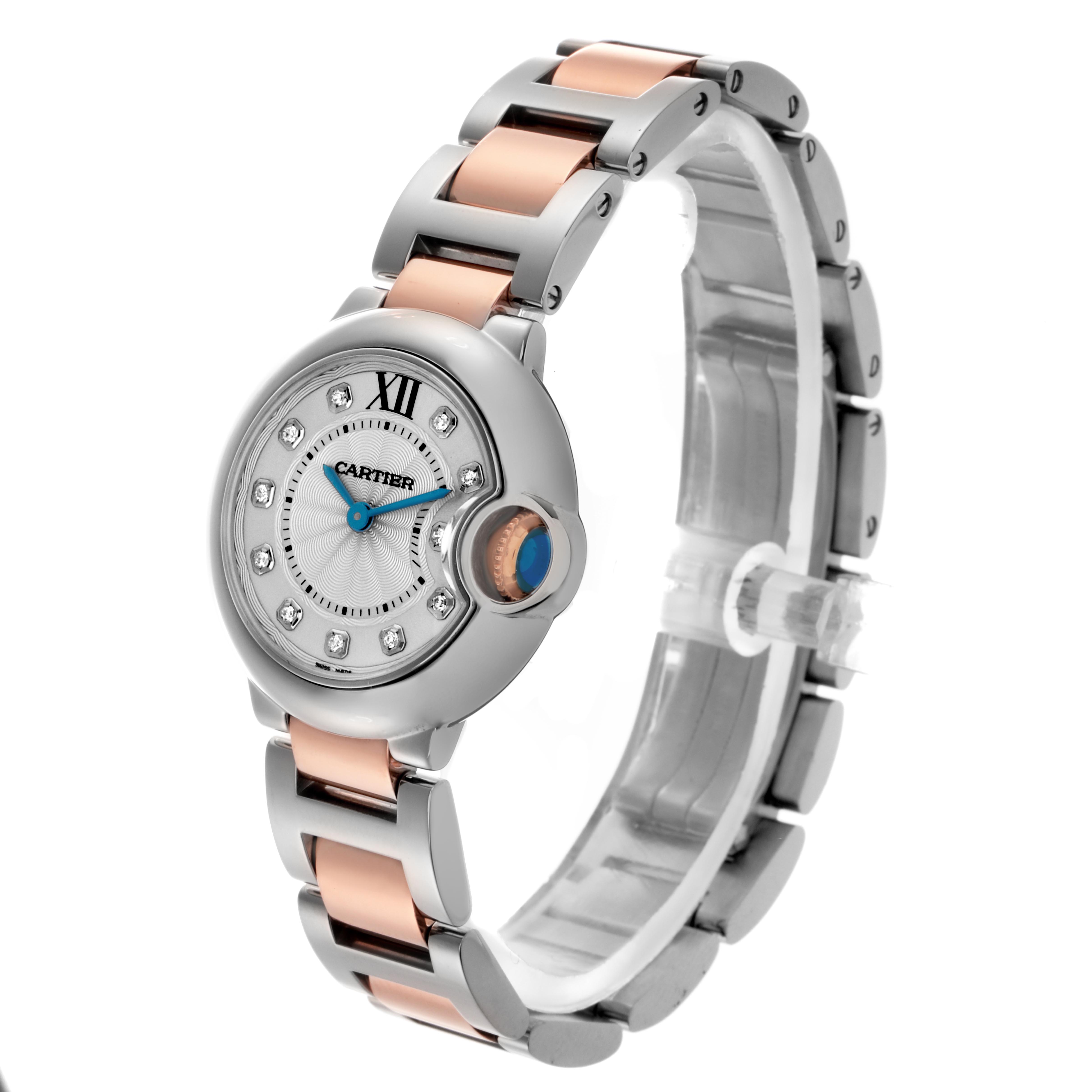 The Cartier Ballon Bleu WE902030 Women
s Steel and Gold (two tone) Silver Dial WE902030 Women
s Steel and Gold (two tone) Silver Dial watch is shown at a slight angle, highlighting the dial, bezel, and two-tone bracelet.