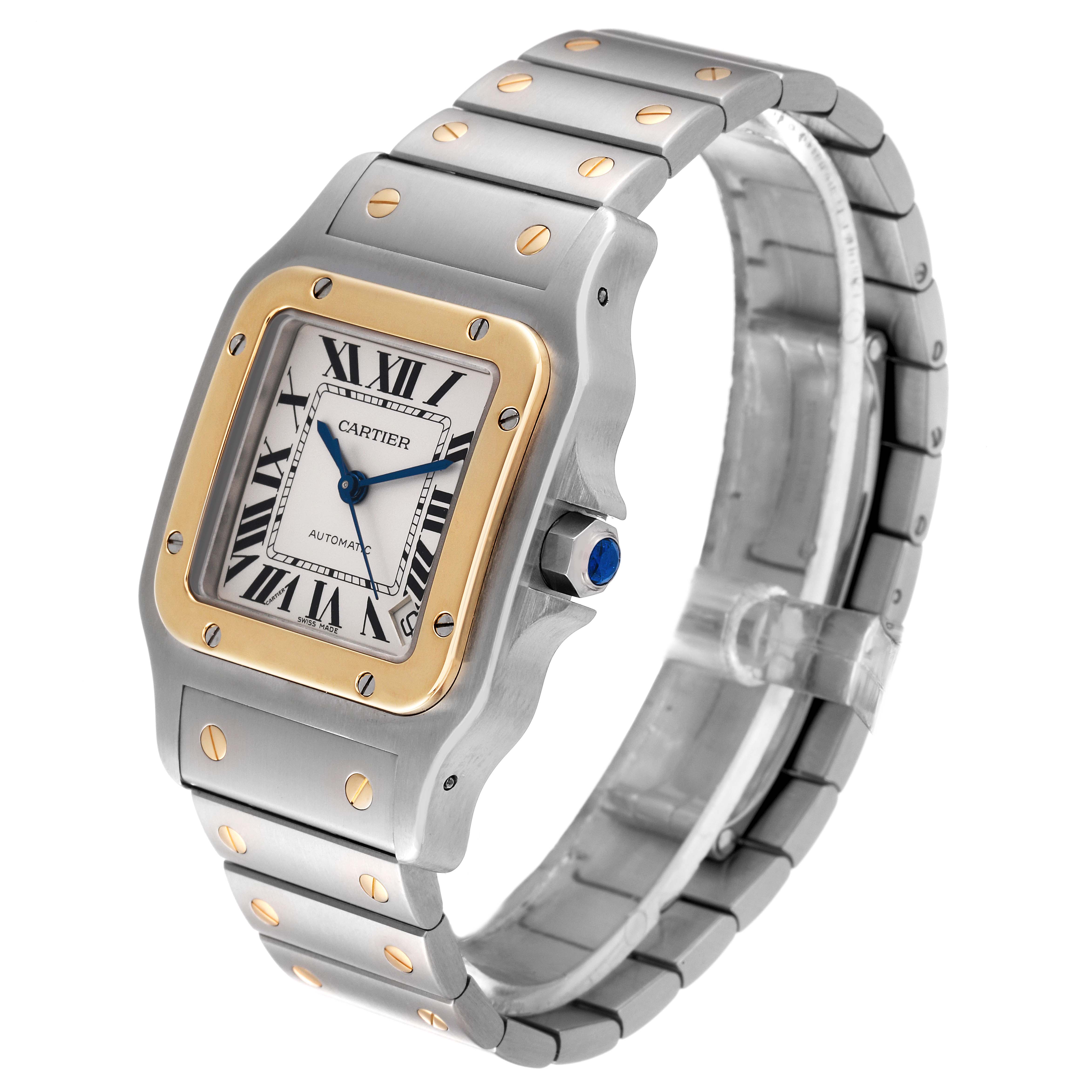 This image shows a Cartier Santos W20099C4 Men
s Steel and Gold (two tone) Silver Dial W20099C4 Men
s Steel and Gold (two tone) Silver Dial watch, focusing on the face, bezel, and metal bracelet at an angled side view.
