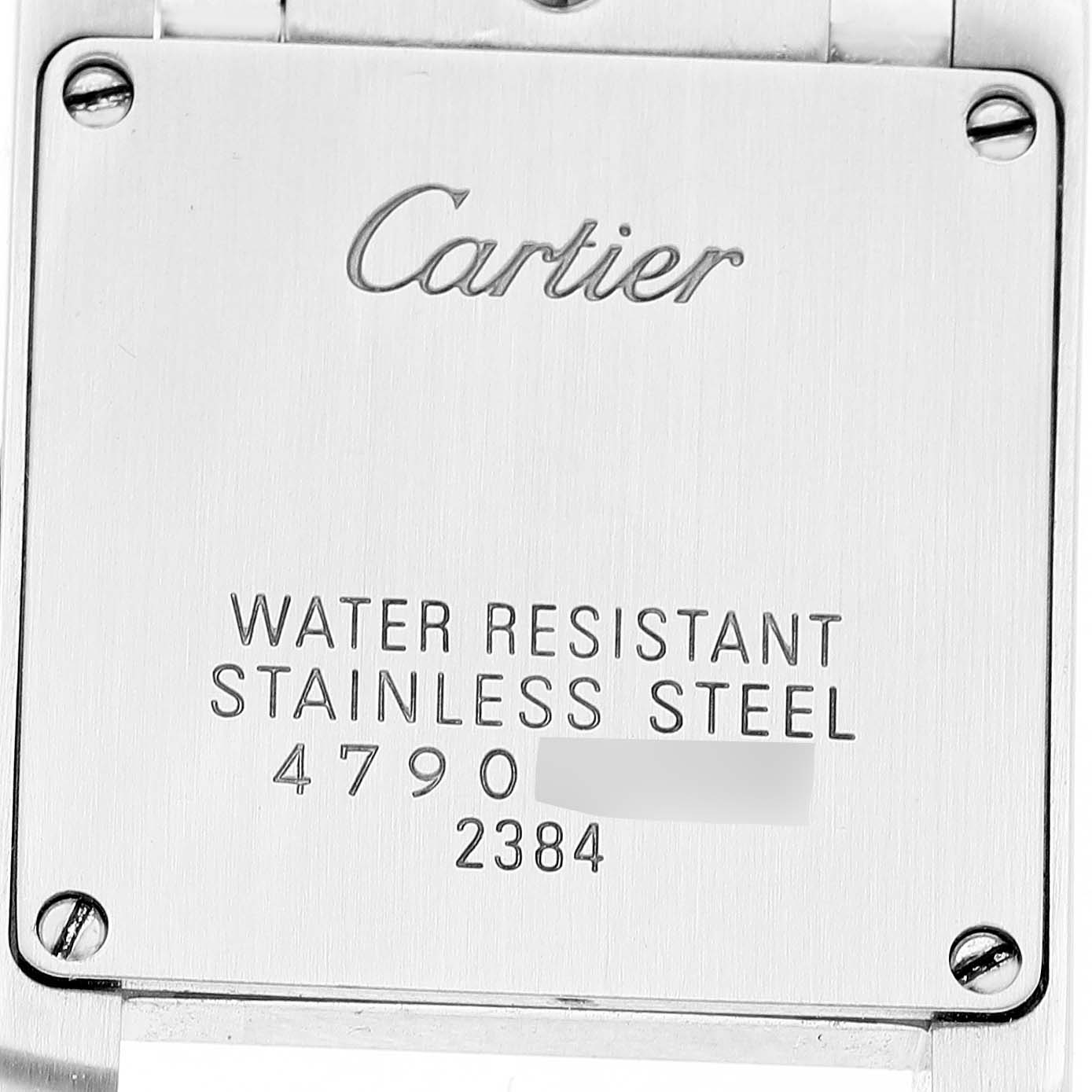 This image shows the back plate of a Cartier Tank Française watch, displaying brand engraving and specifications.